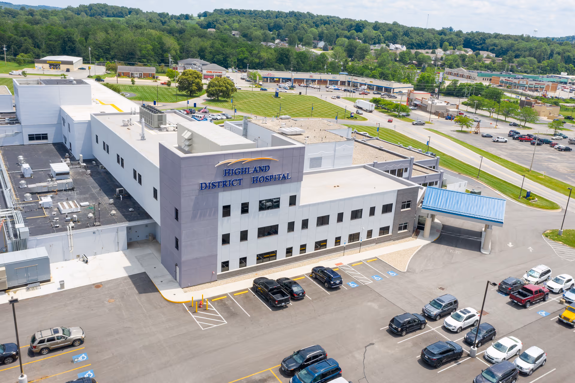 Aerial view of Highland District Hospital with surrounding parking lot.