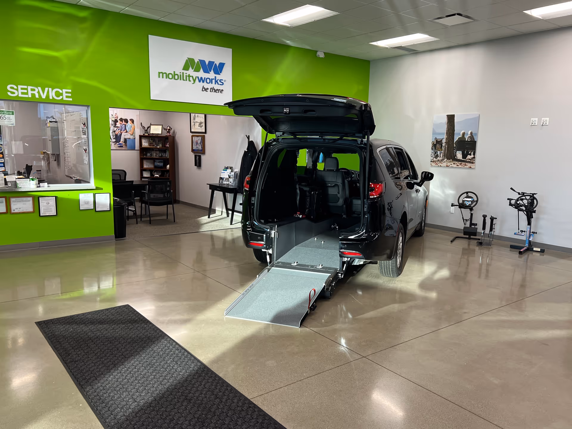 MobilityWorks showroom interior featuring a wheelchair-accessible van with its ramp extended.