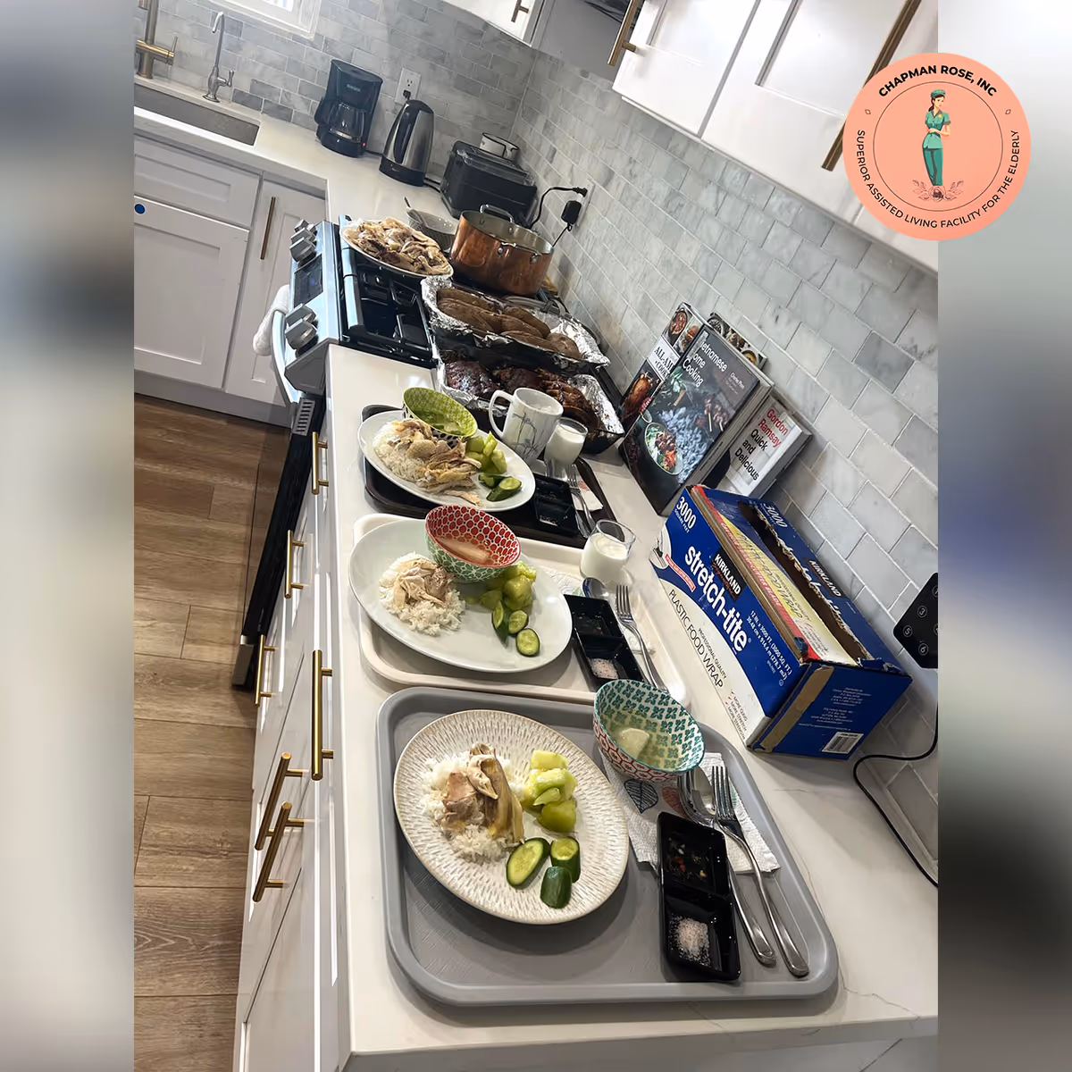 Kitchen counter with plated meals and appliances in a residential care kitchen.