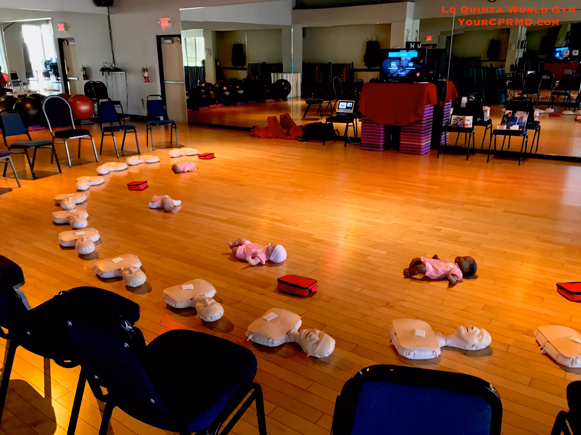 Interior CPR training room with mannequins arranged for hands on resuscitation practice.