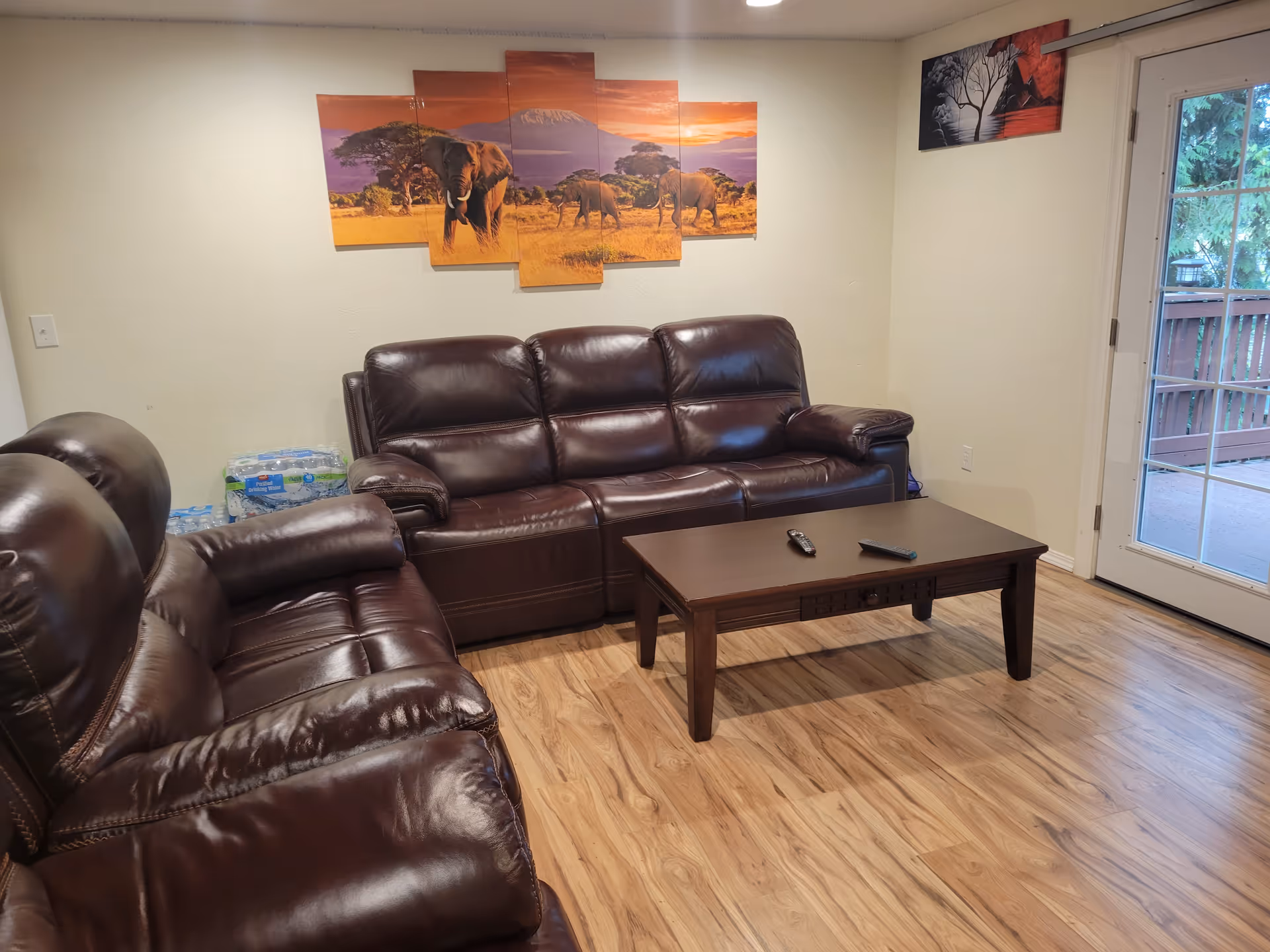 Cozy leather sofa set with coffee table in a bright living room.