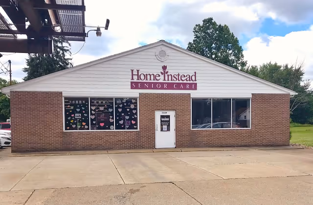 Front view of a Home Instead Senior Care building with brick facade and windows.