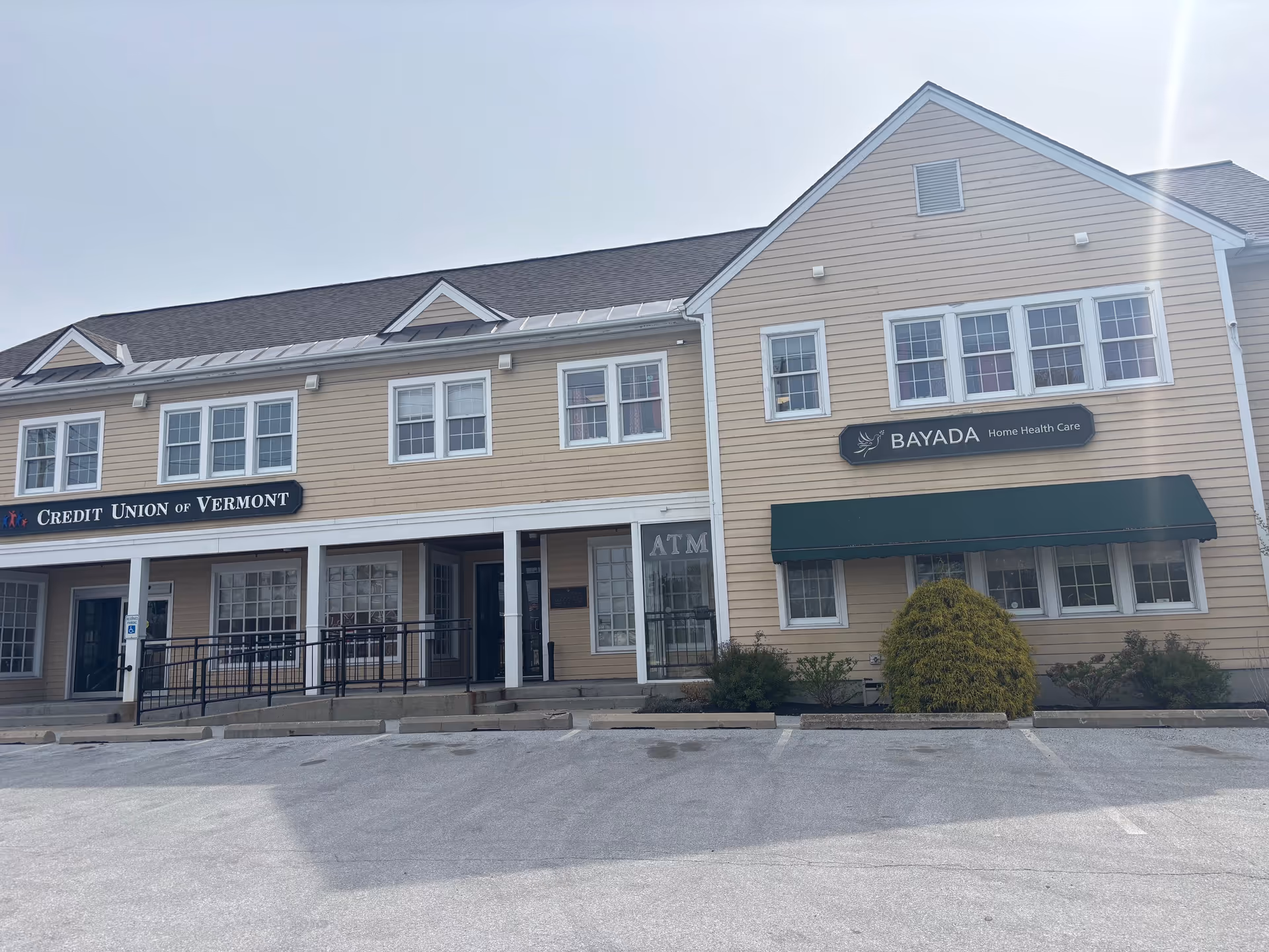 Exterior view of a two-story beige building with BAYADA Home Health Care sign.