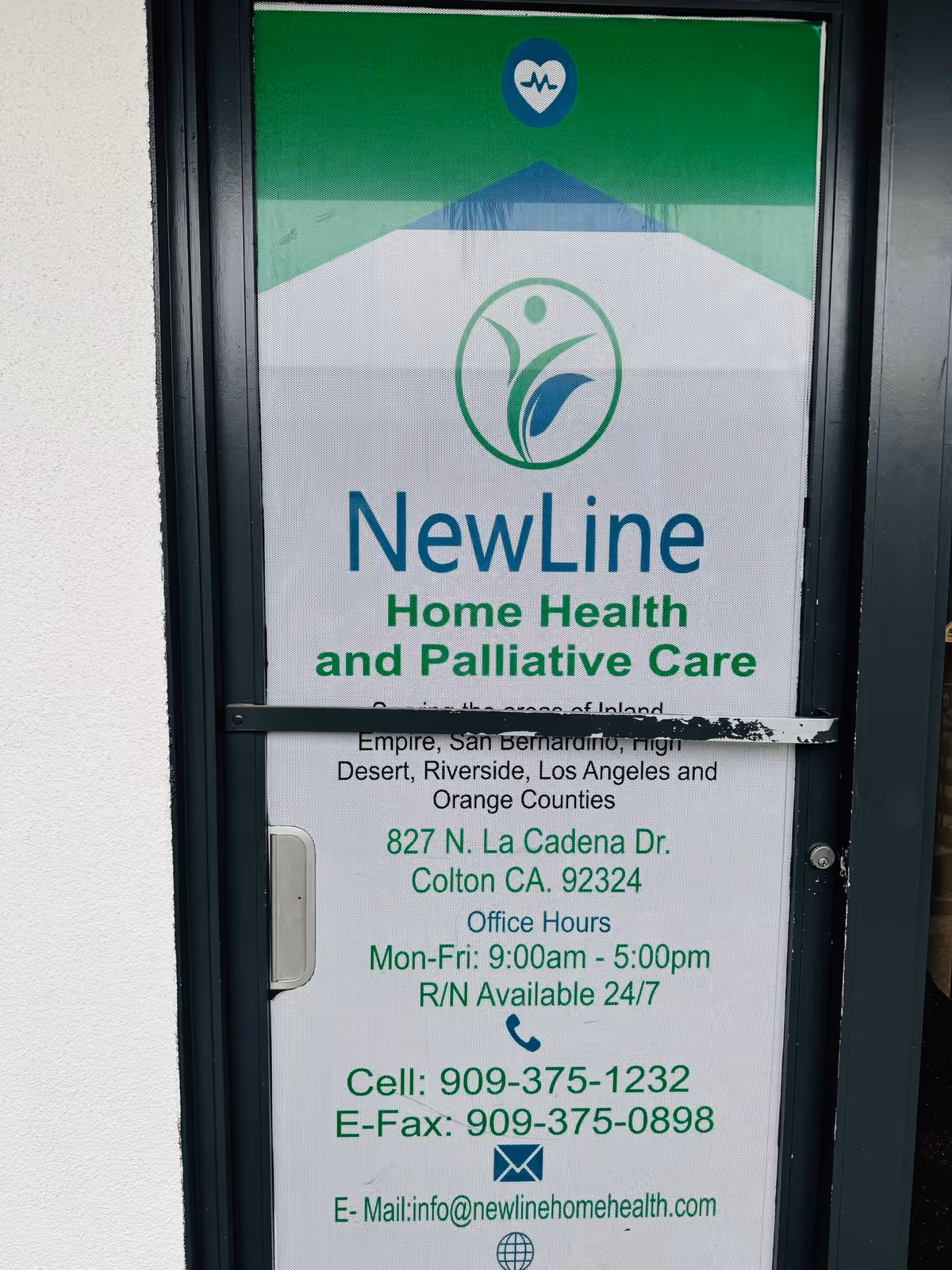 Door with NewLine Home Health and Palliative Care sign at the front entrance