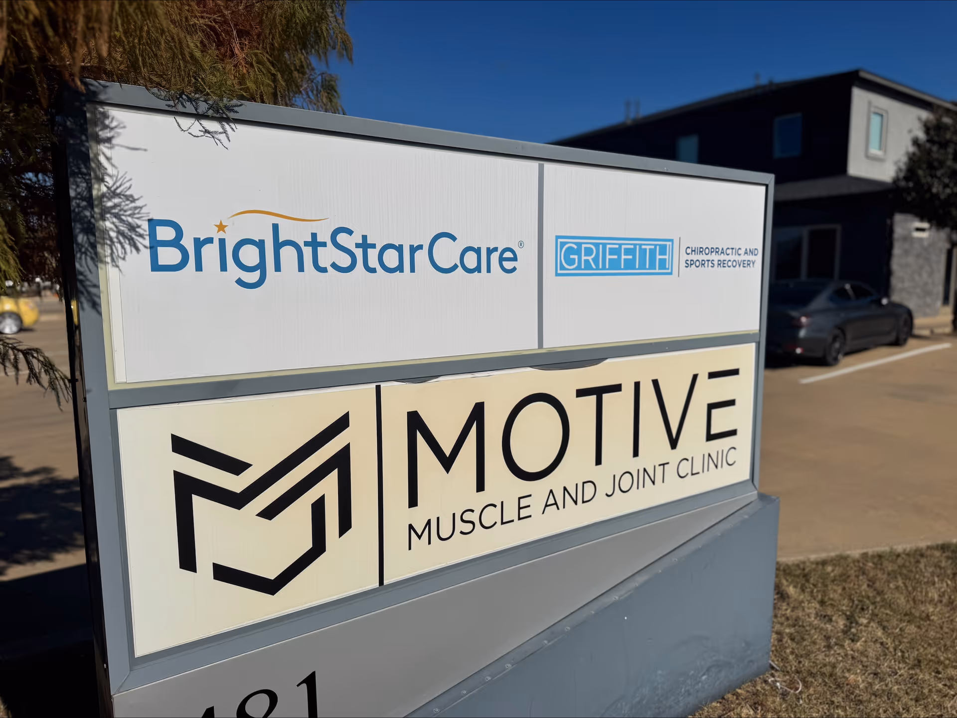 Exterior signboard for BrightStar Care and Motive Muscle and Joint Clinic in front of a building