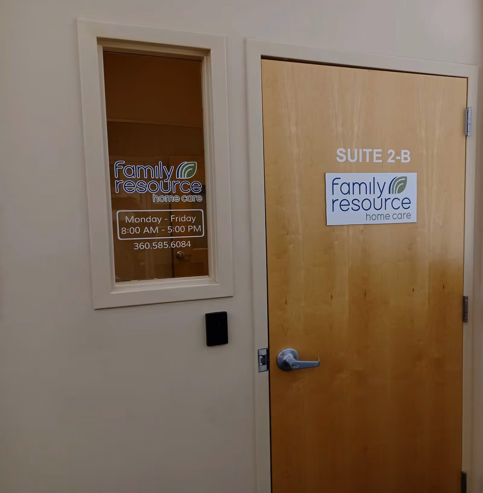A wooden door labeled Suite 2-B beside a window with Family Resource Home Care logos.