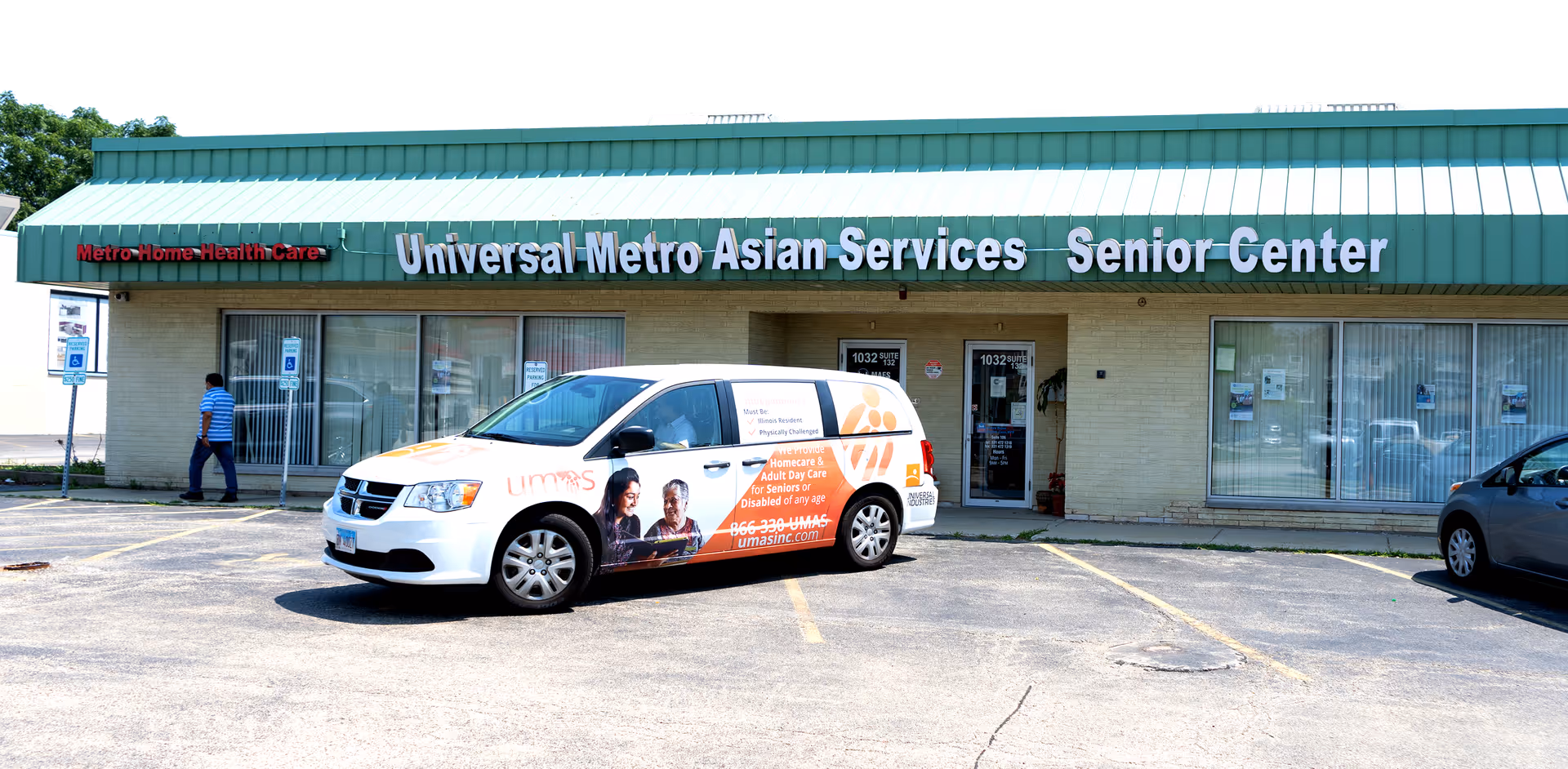 Front of Universal Metro Asian Services Senior Center with a parked promotional van in front.