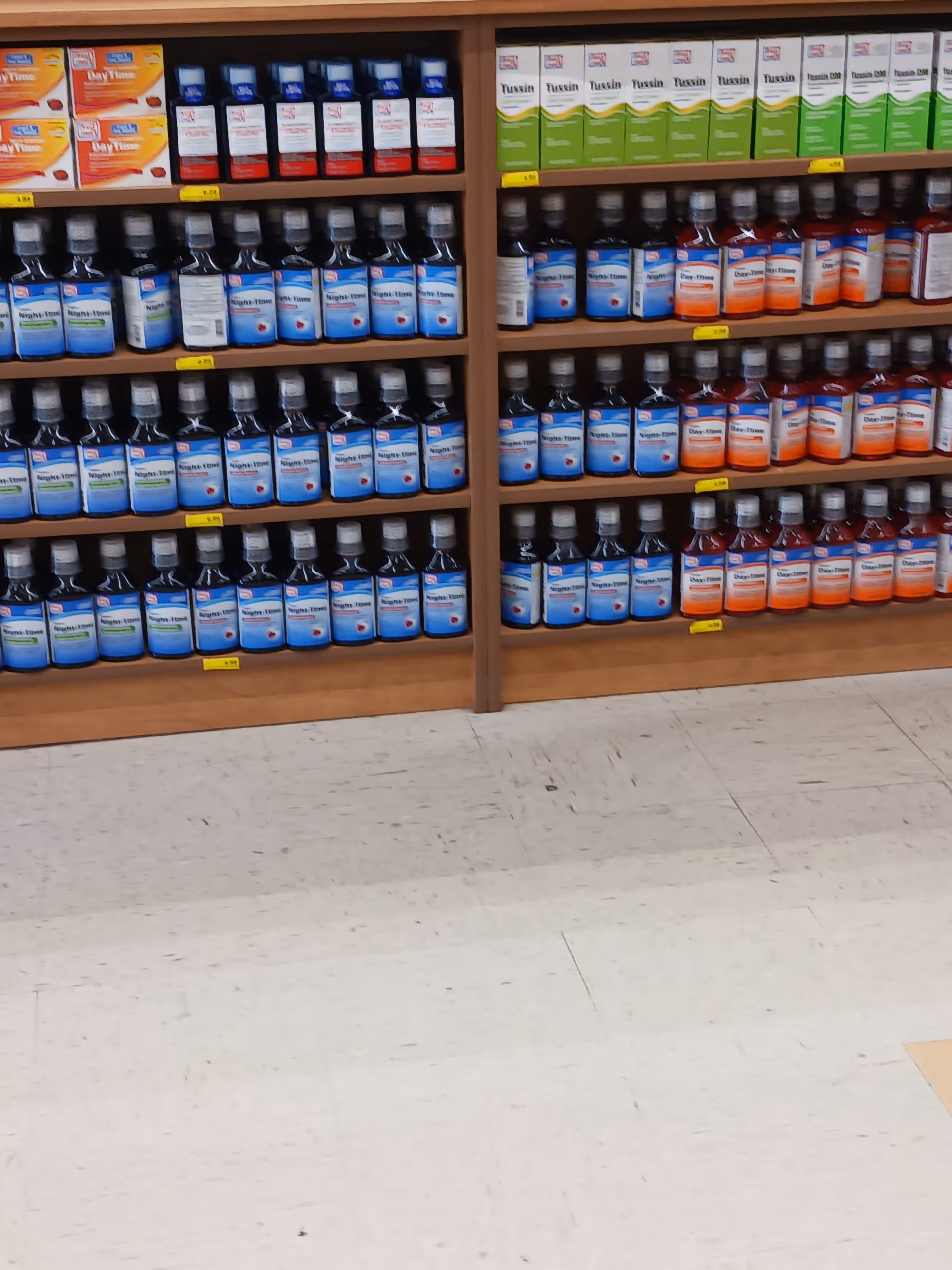 Aisle at Discount Drug Mart with shelves full of bottles and boxes.