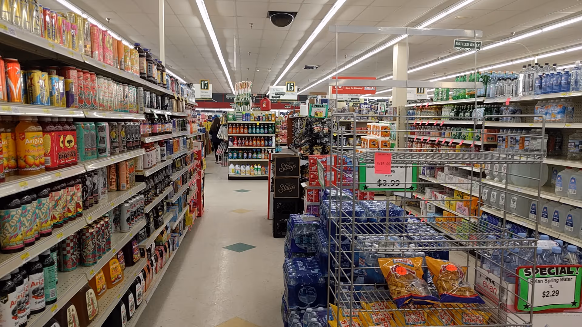 Inside Discount Drug Mart, grocery aisles lined with colorful product shelves.