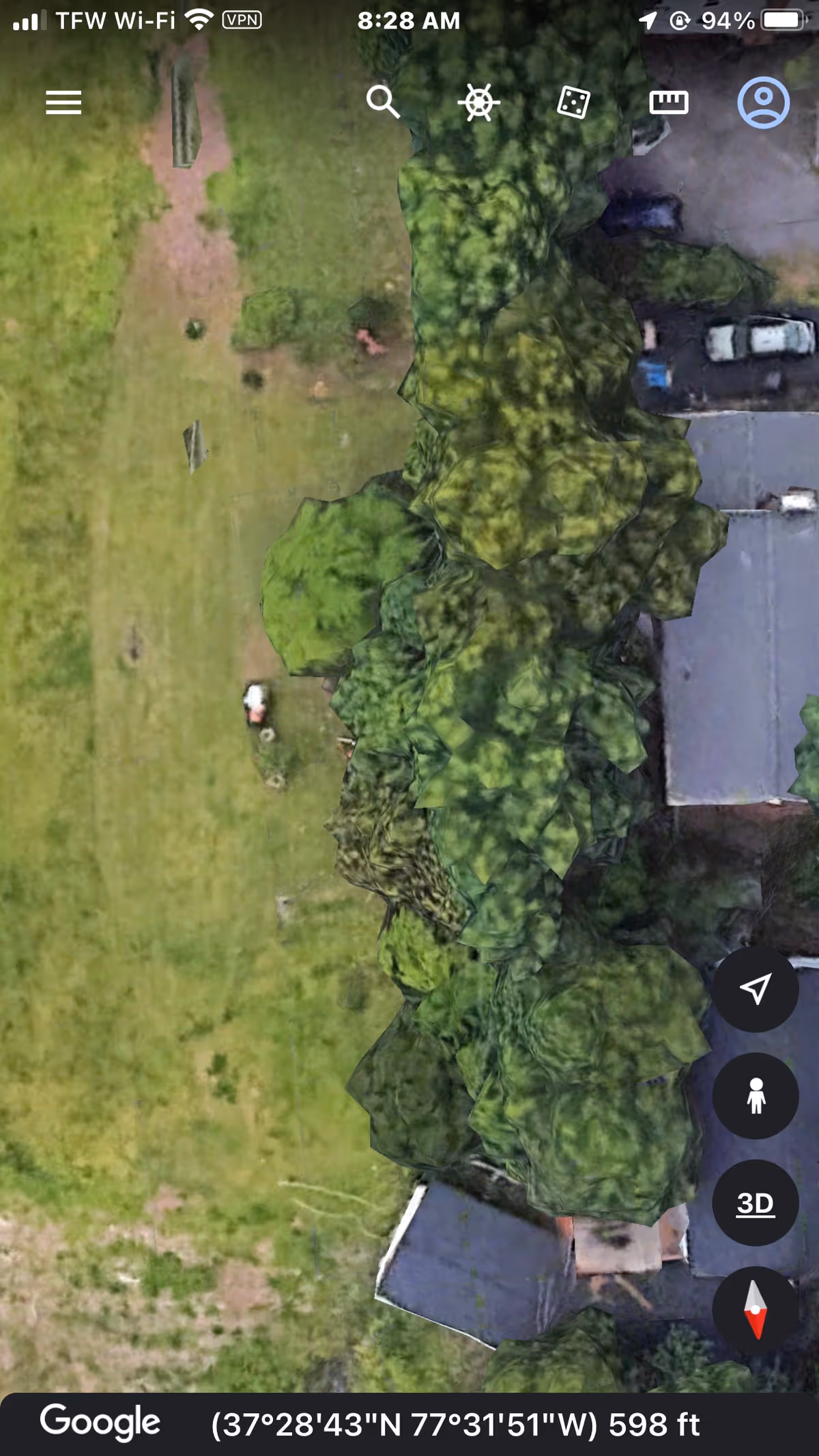 Exterior aerial view of a senior living facility with lawn and trees.