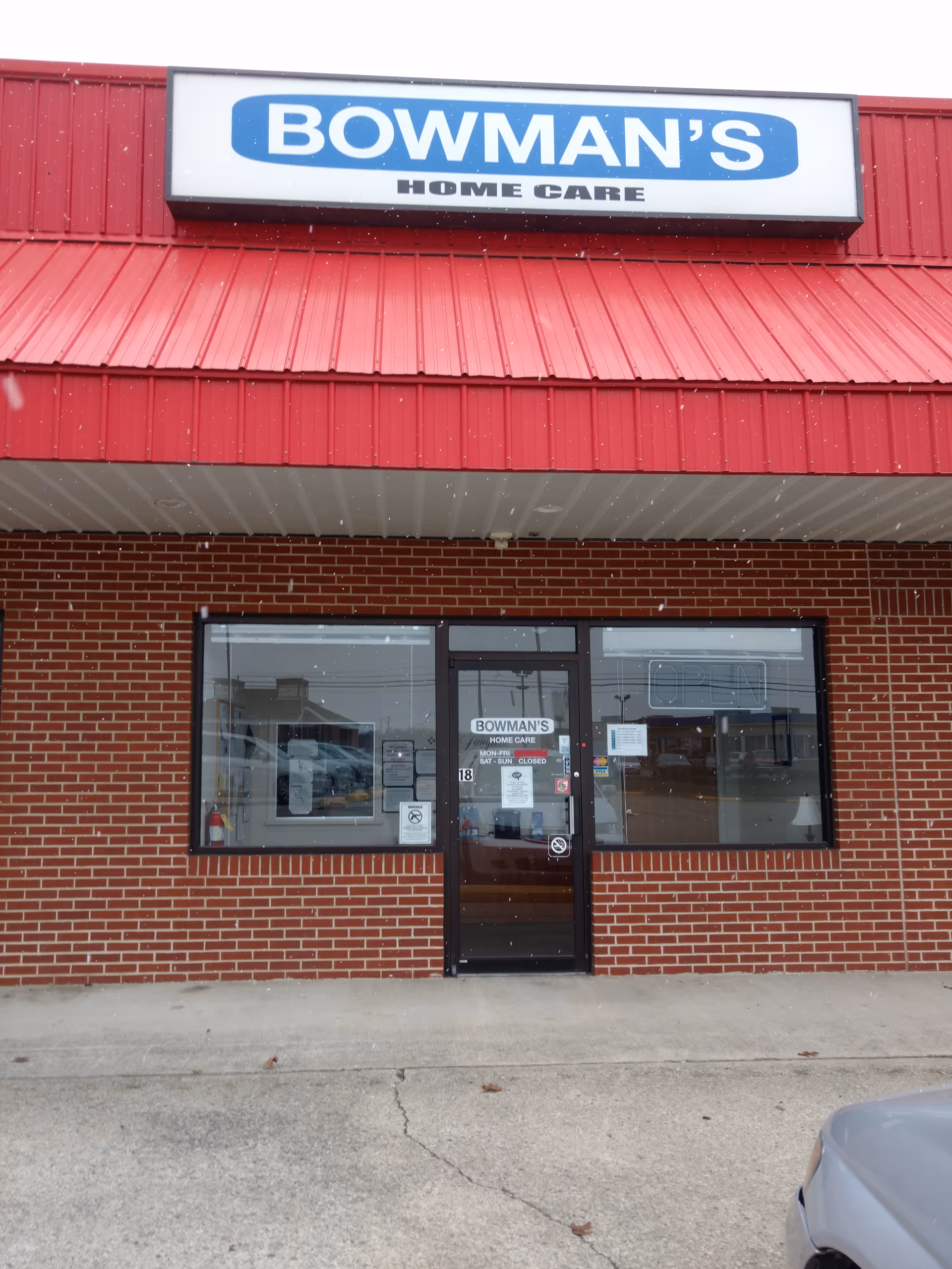 Front view of Bowman's Home Care building with brick exterior and glass entrance.