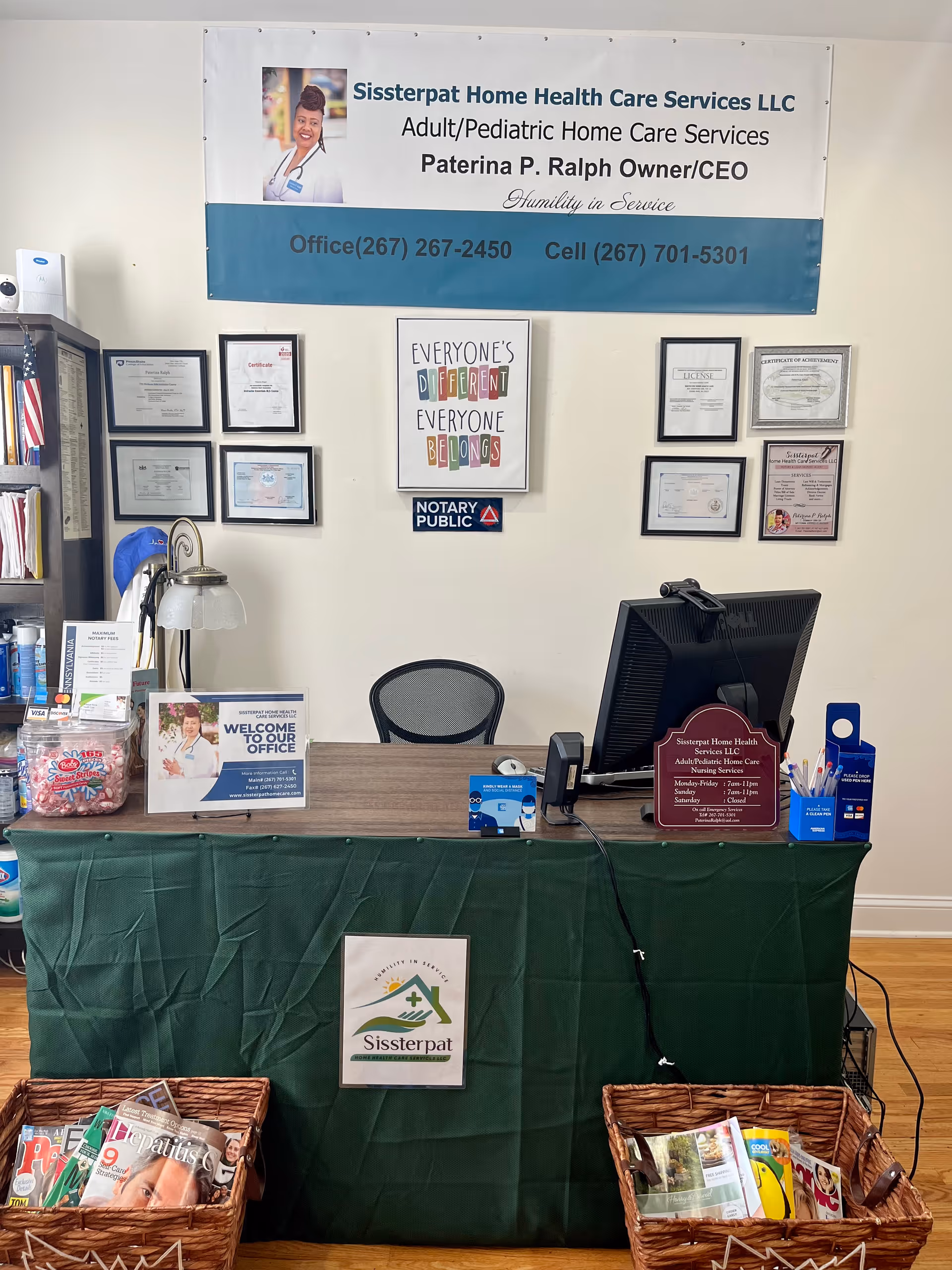 Reception area of Sissterpat Home Health Care Services LLC with banners and certificates.