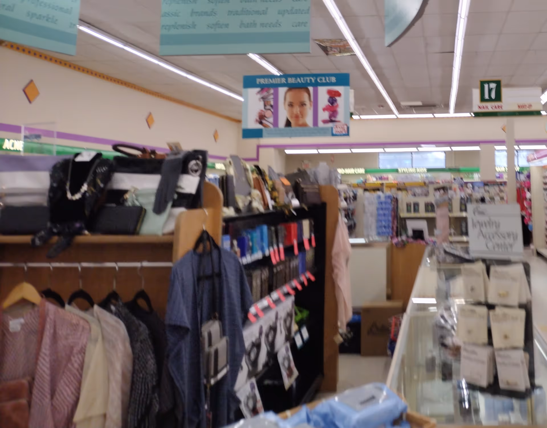 Interior of Discount Drug Mart showing clothing racks and store aisles with shelves