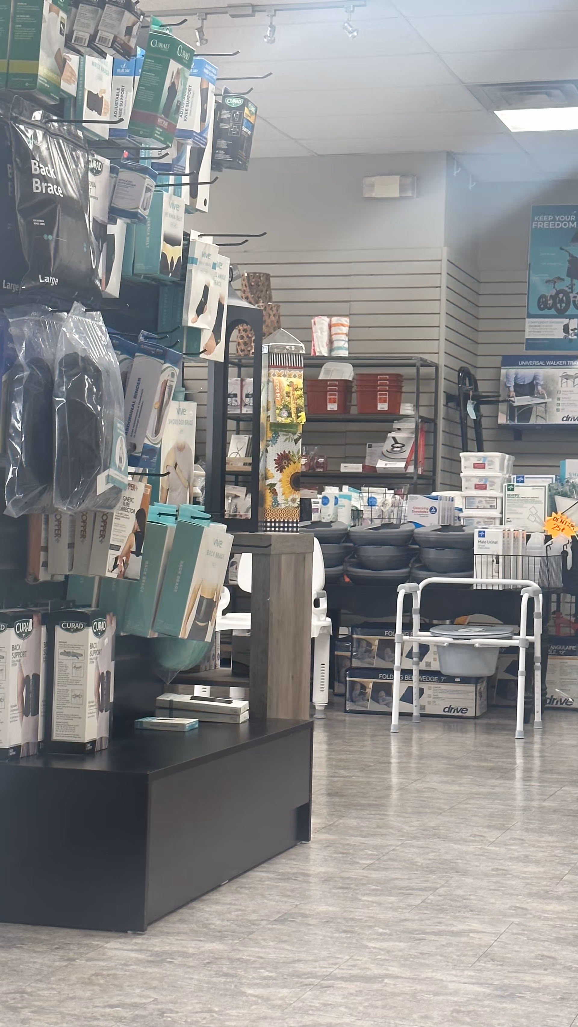 Indoor aisle of medical supplies on shelves in a well-lit retail area.