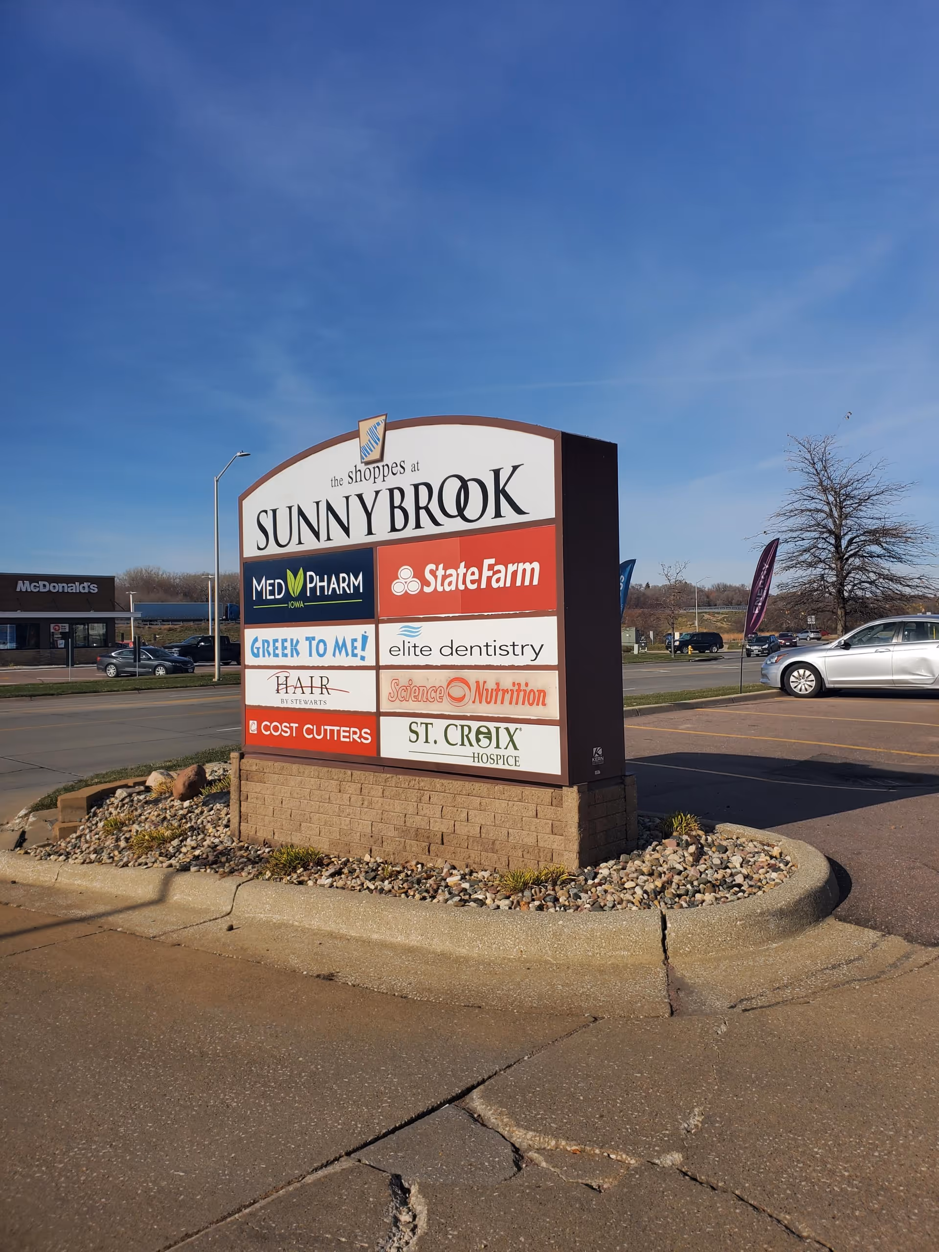 Outdoor sign at Sunnybrook shoppes with logos including St. Croix Hospice.