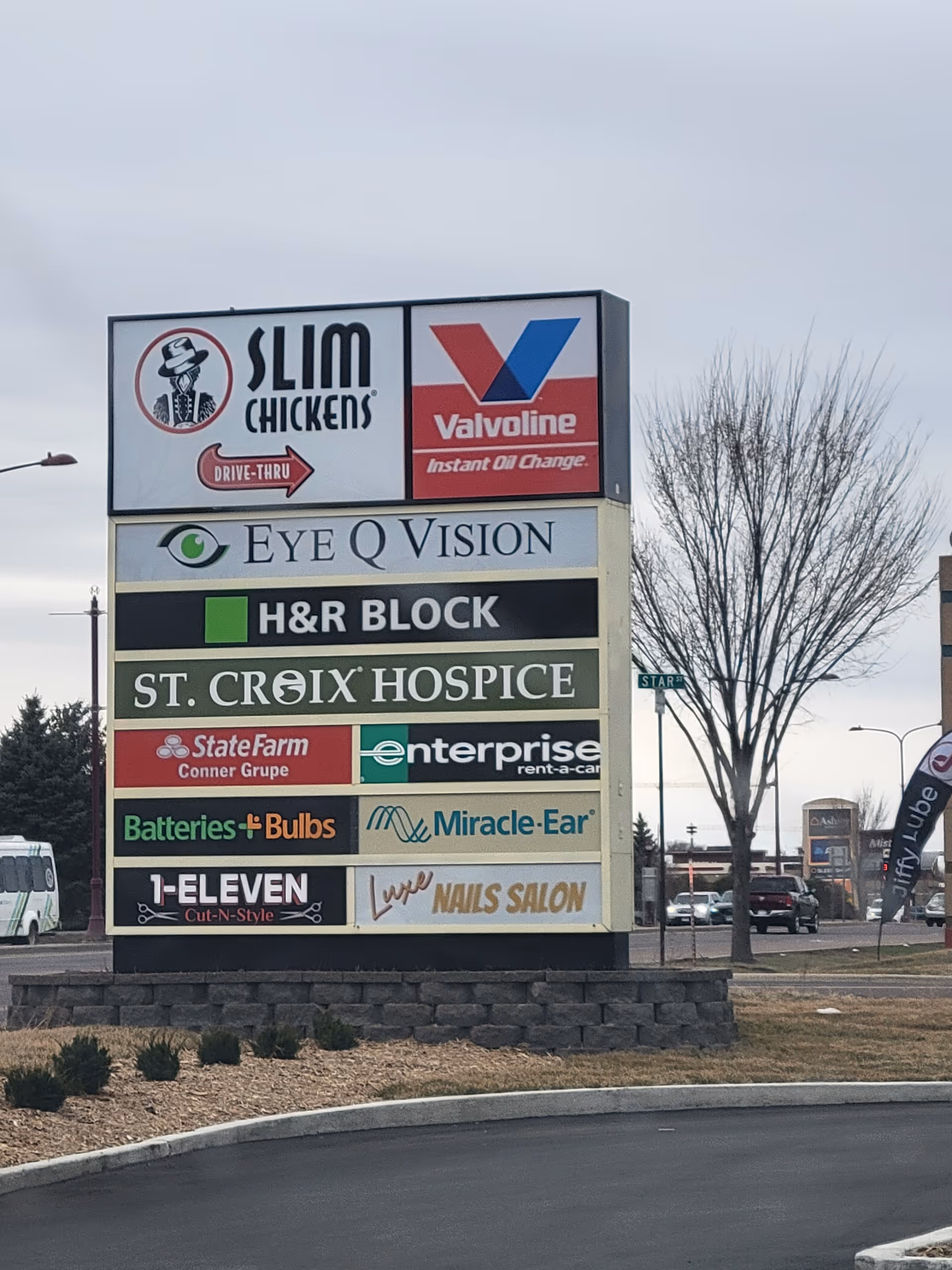 A multi-tenant outdoor signboard listing St. Croix Hospice among others.