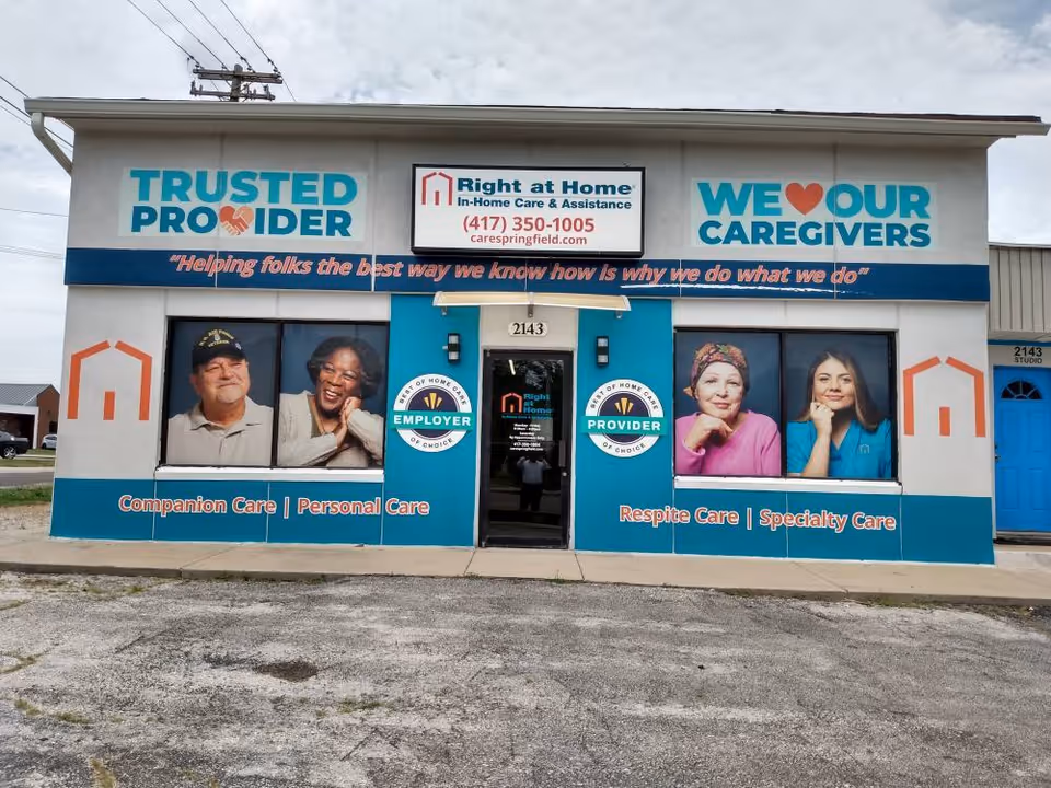 Exterior view of a Right at Home senior care storefront with large banners.