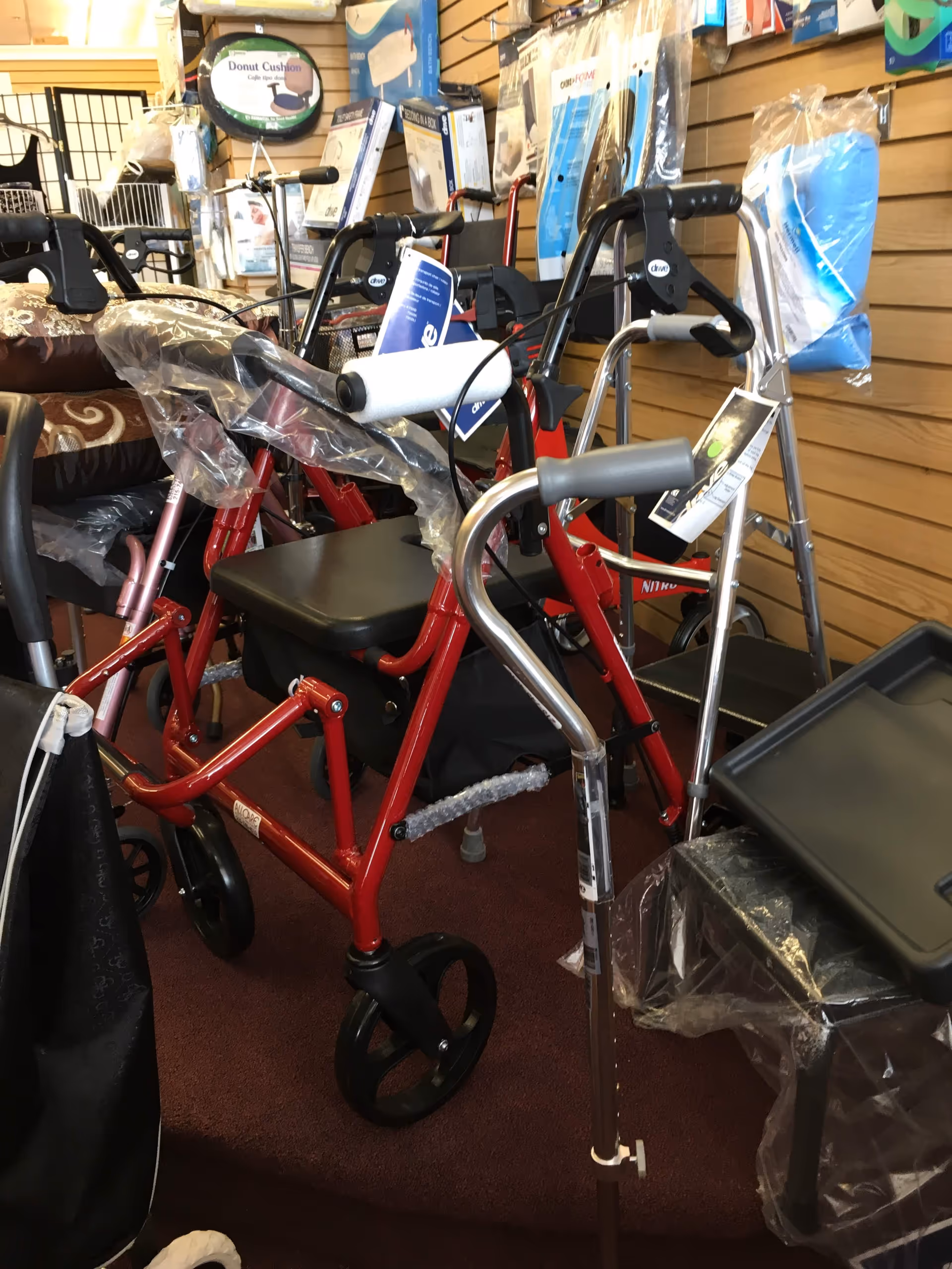 Indoor display of mobility aids like walkers and canes in a medical equipment shop.