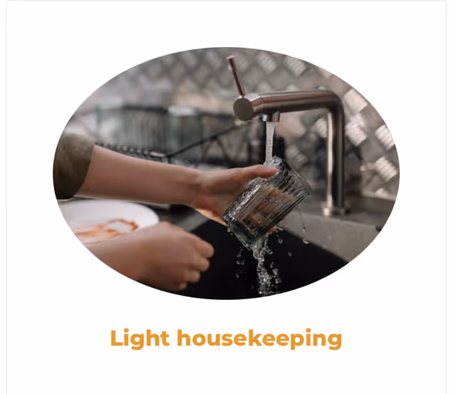 Person washes a dish at a kitchen sink.