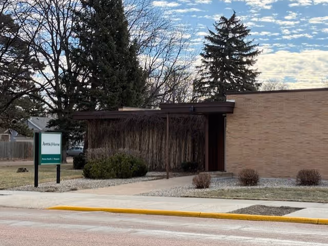 Exterior view of Avera@Home Home Health Mitchell building with sign and landscaped entrance.