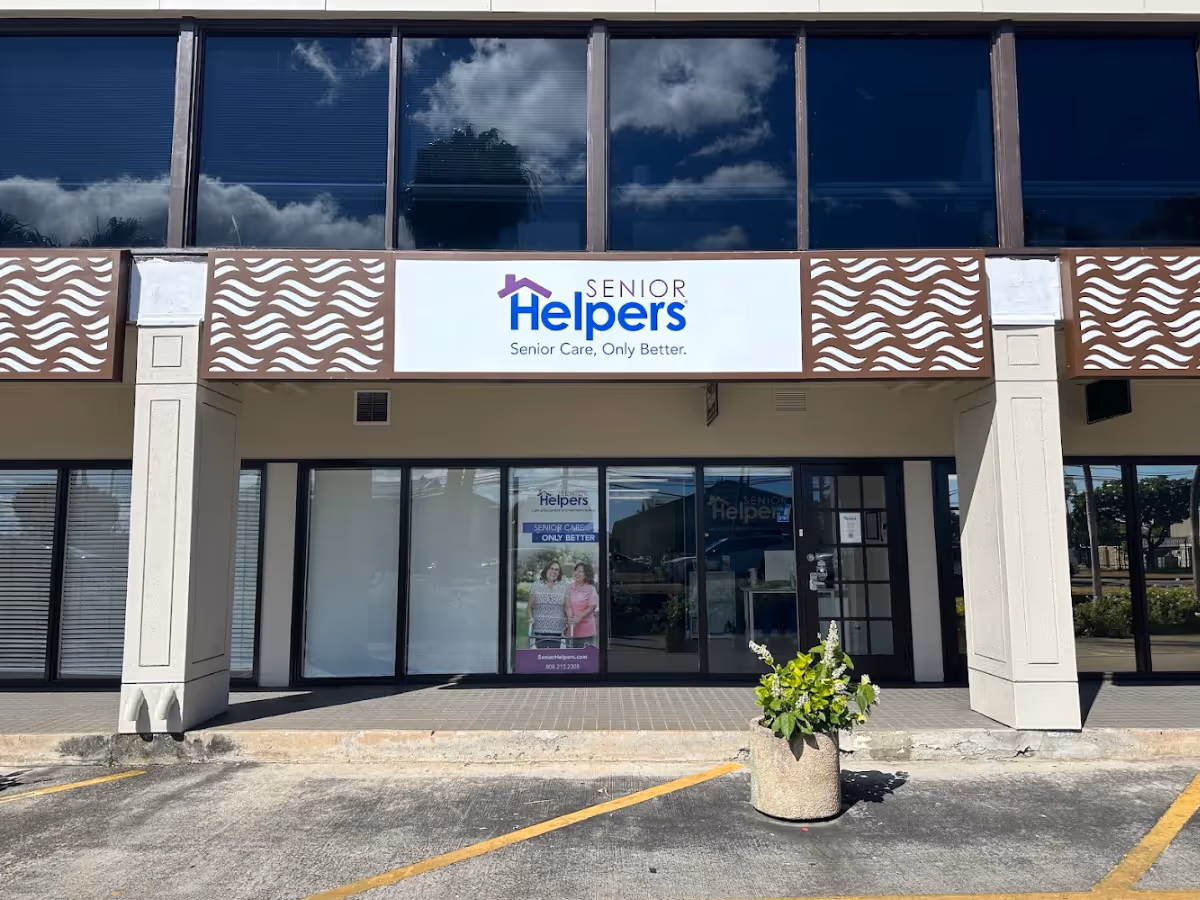 Front exterior of a Senior Helpers facility with glass storefront and signage.