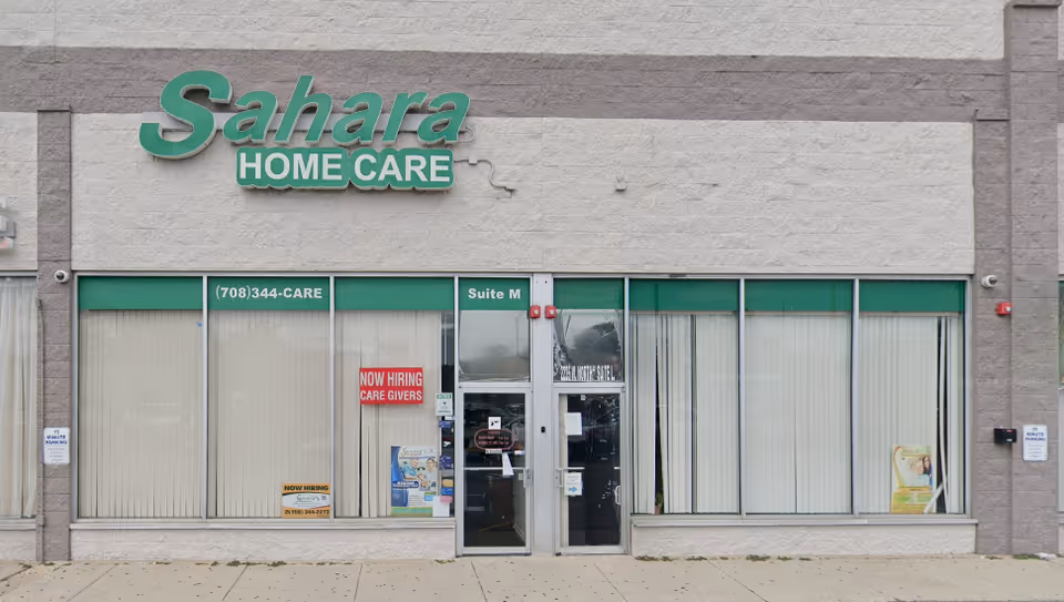 Front of Sahara Home Care storefront with glass windows and double doors.