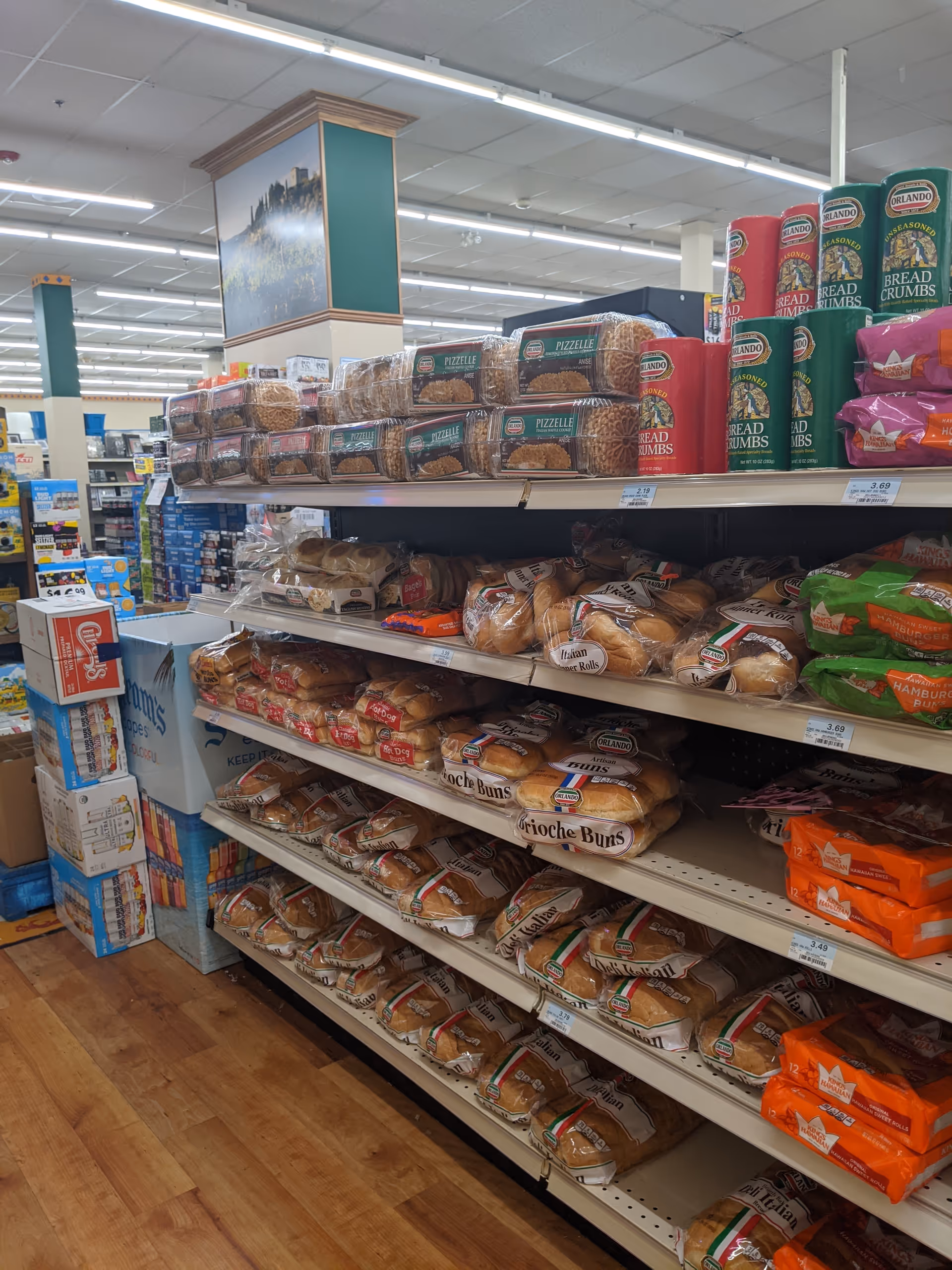Interior aisle with bread shelves and packaged goods at Discount Drug Mart.