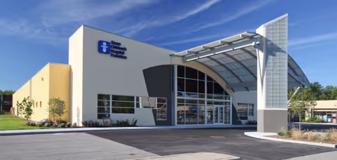 Front exterior of Akron Children's Outpatient Lab Warren with curved glass entry.