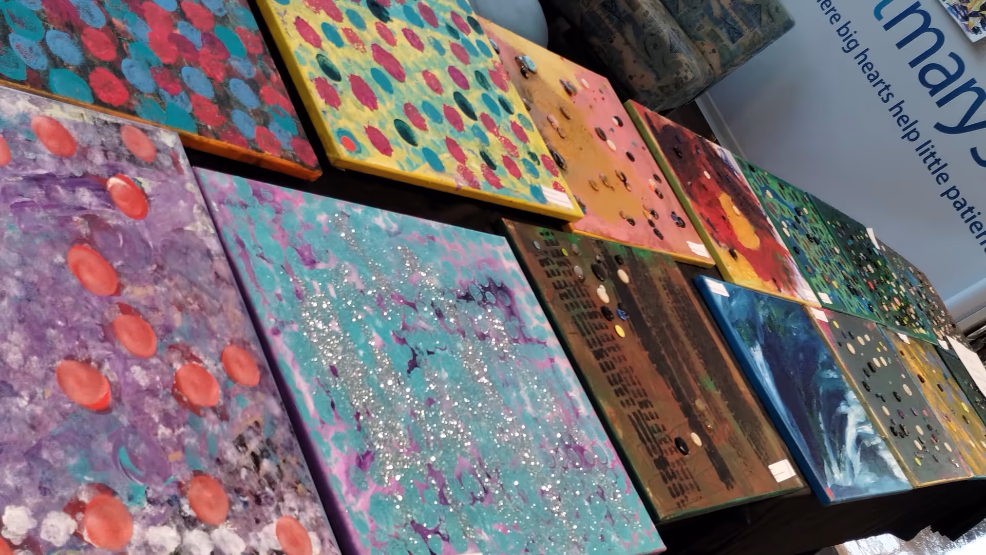 Colorful abstract panels line a display wall inside St. Mary's Hospital For Children.