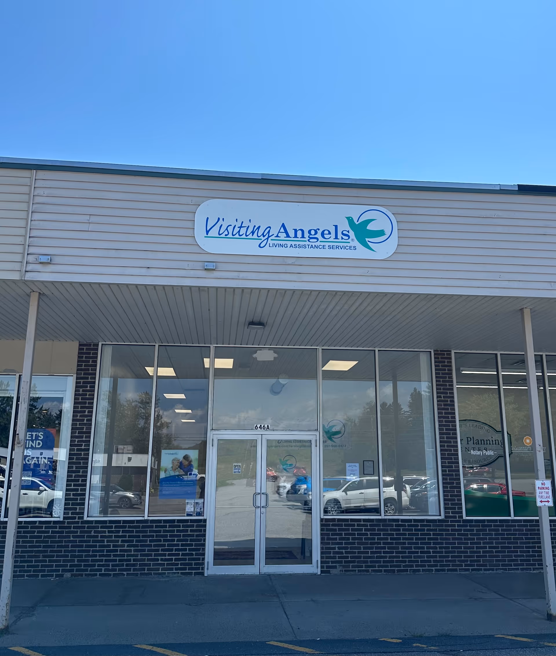 Front view of Visiting Angels senior home care storefront with large logo sign.
