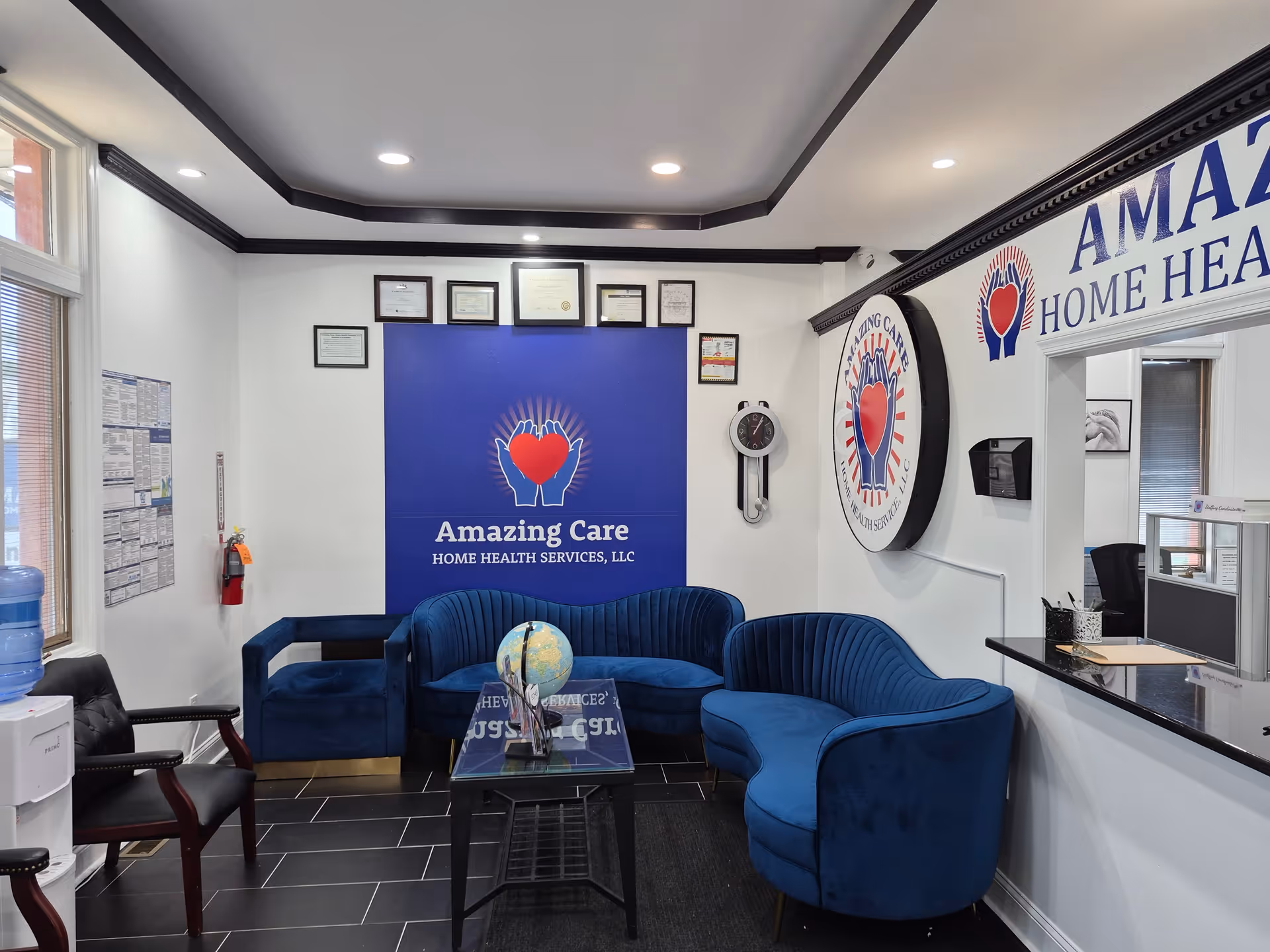 Lobby area with blue seating and signage for Amazing Care Home Health Services, LLC.