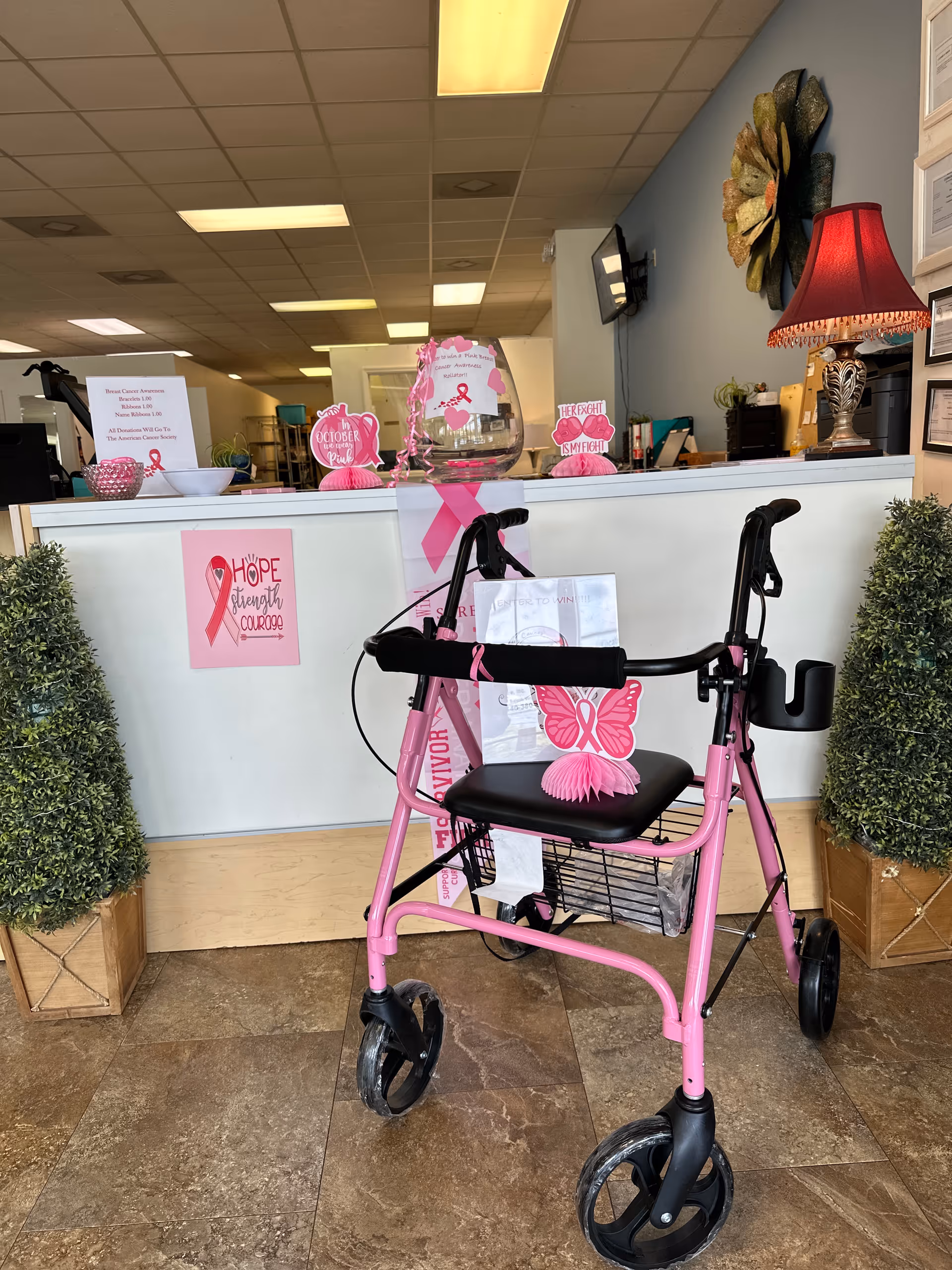 Pink walker in a pink themed reception area of a senior care facility.