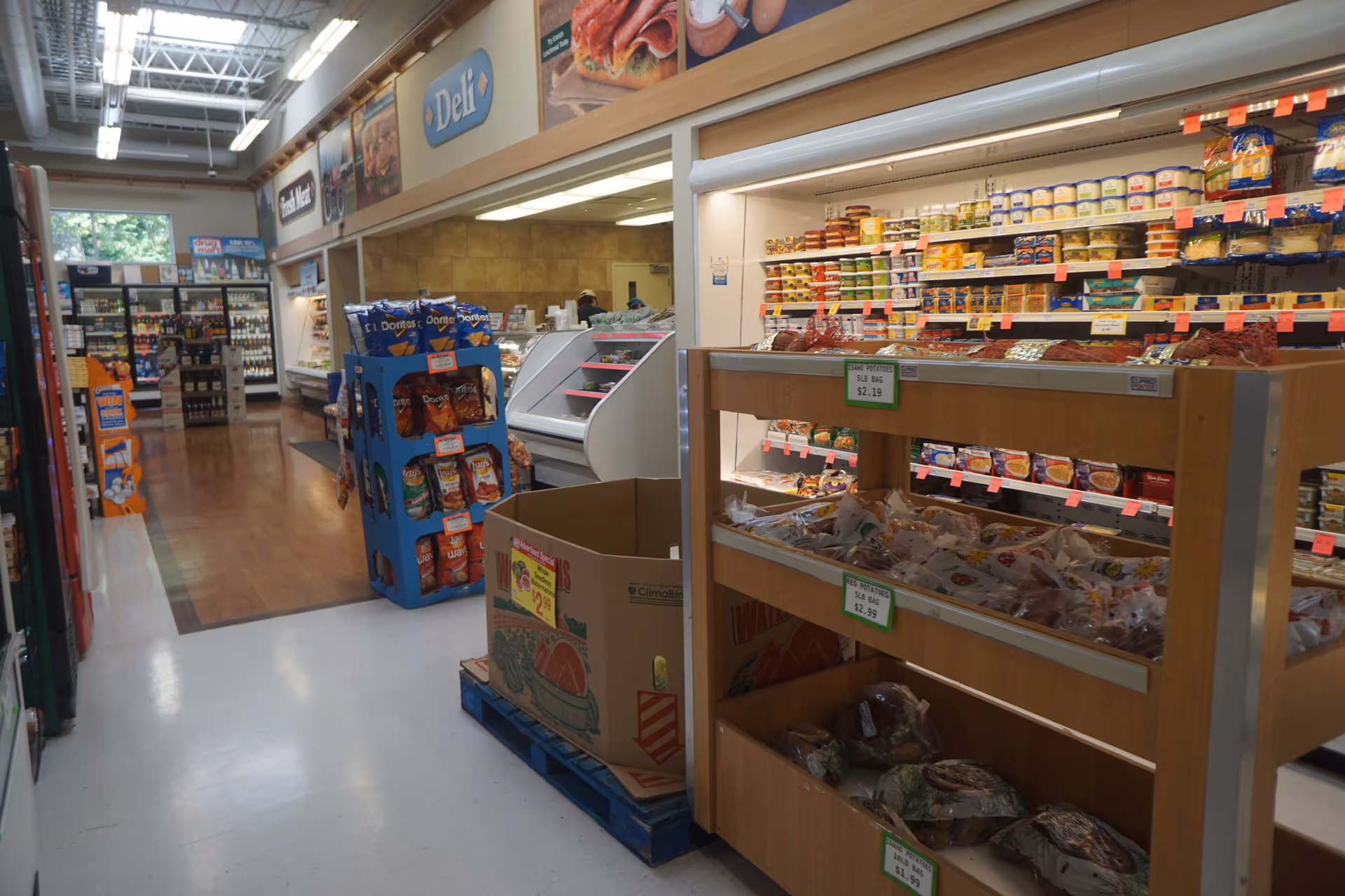 Interior of a Discount Drug Mart store with aisles, shelves, and display cases.