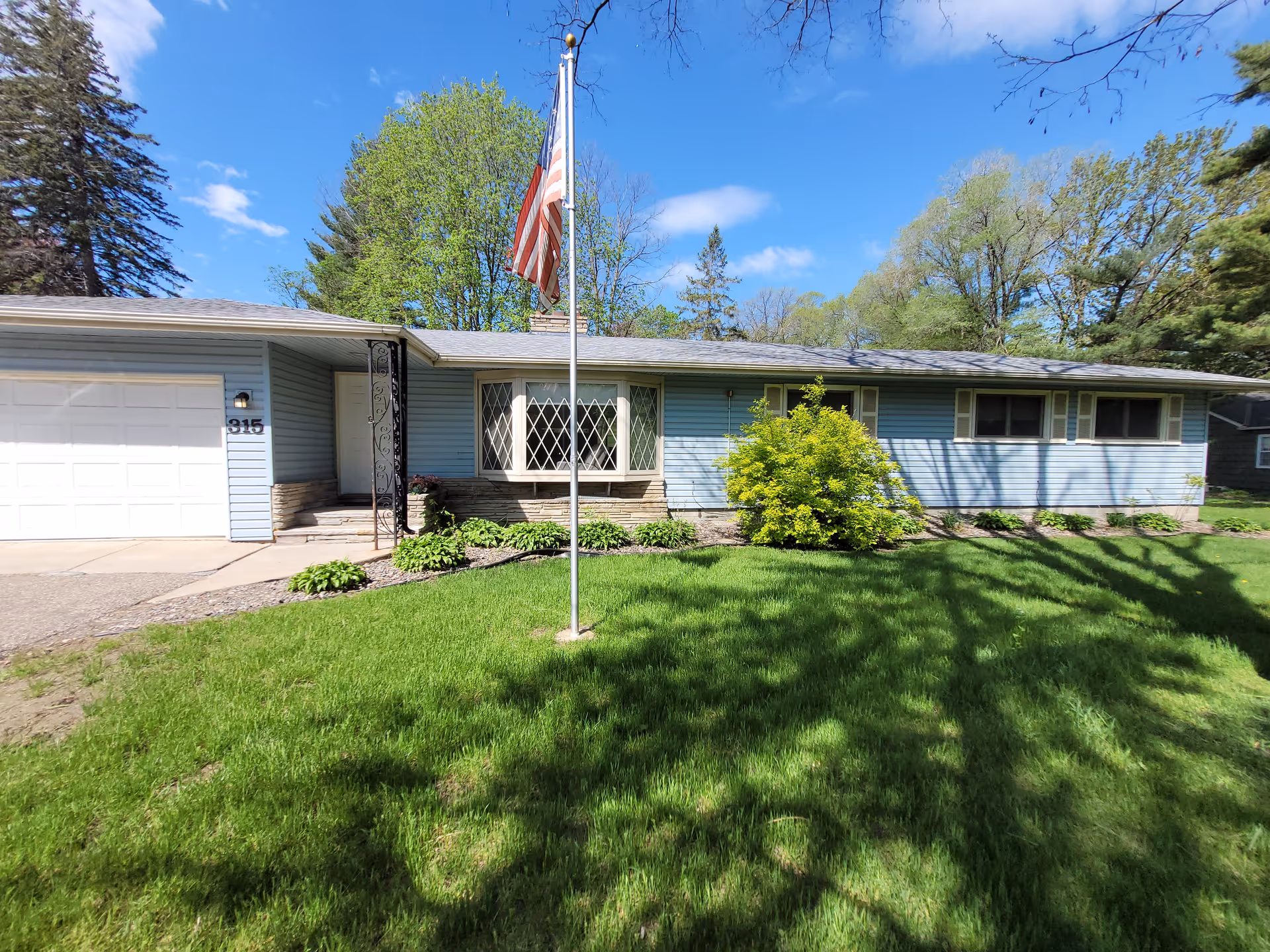 The Homeward Bound Inc facility is a blue, single-story building with a flagpole and lawn.
