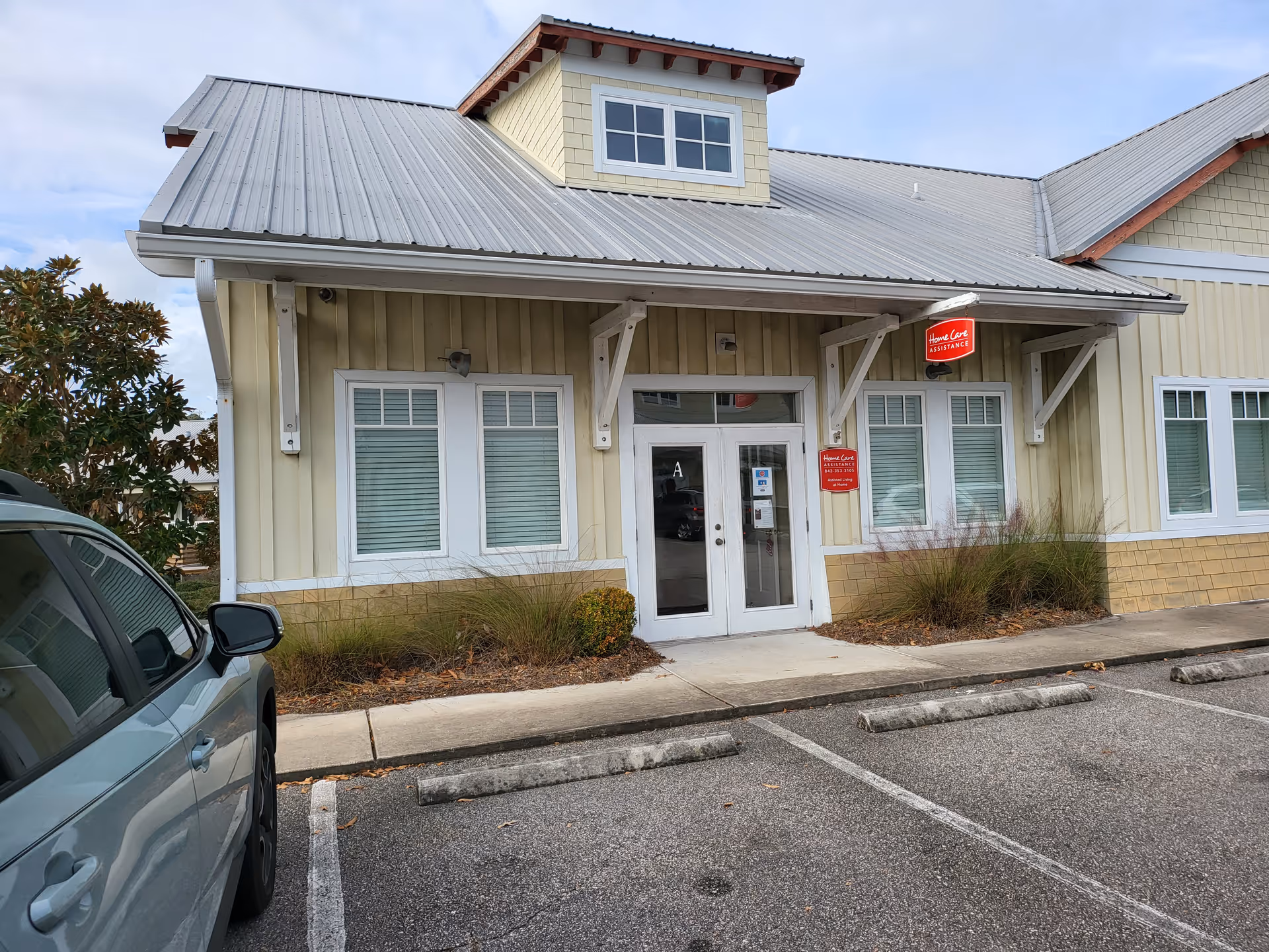 Front exterior of TheKey Senior Home Care facility with entrance, windows, and parking.