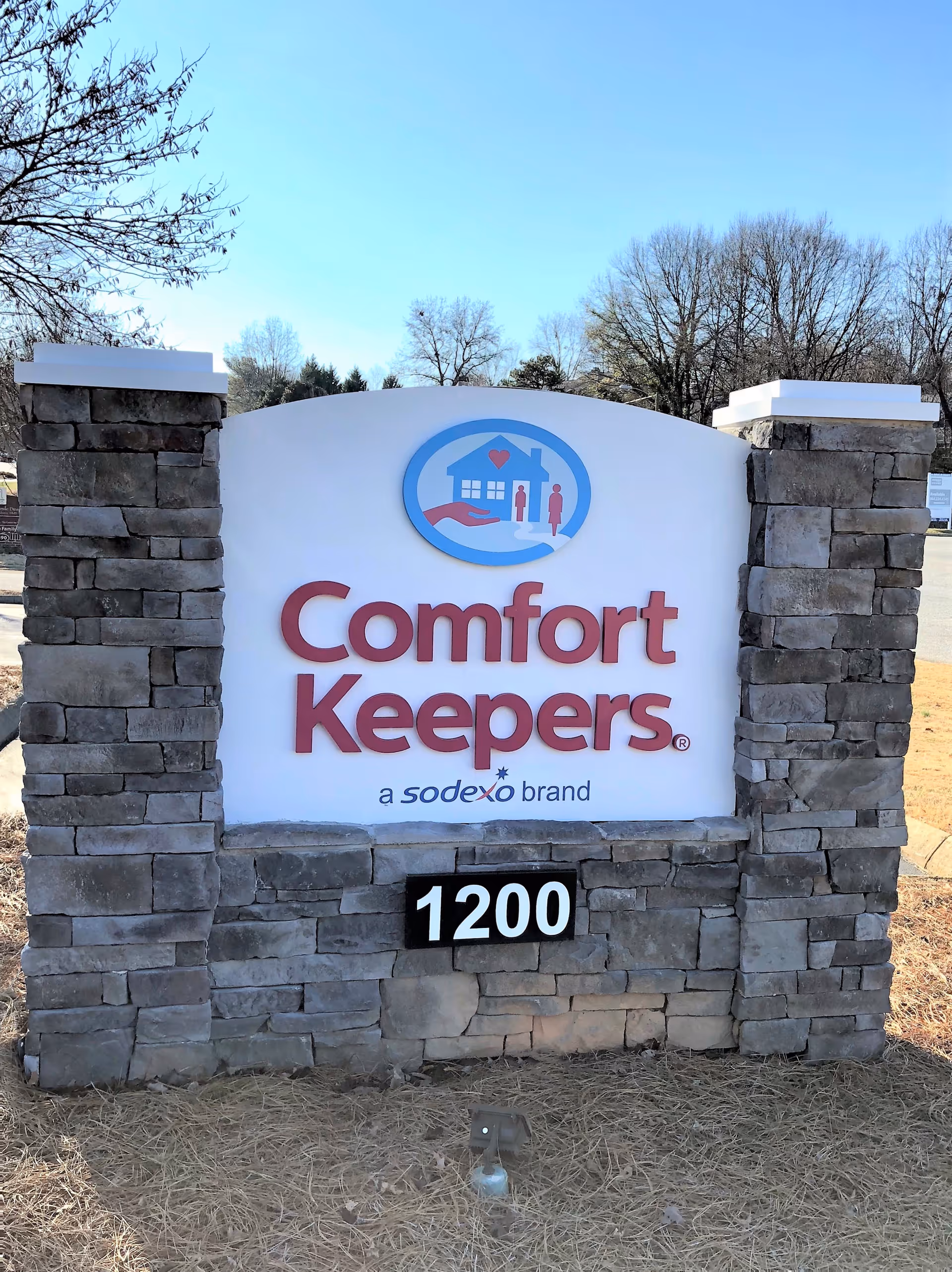 Stone sign for Comfort Keepers Home Care with 1200 address.