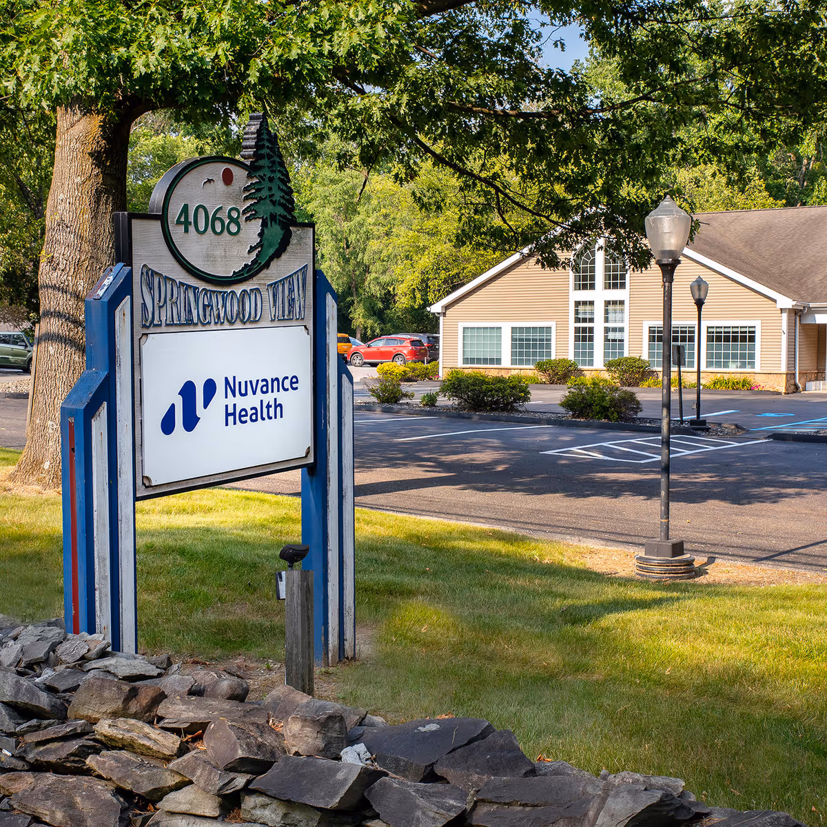 Outdoor view of Springwood Village sign and Nuvance Health building frontage.