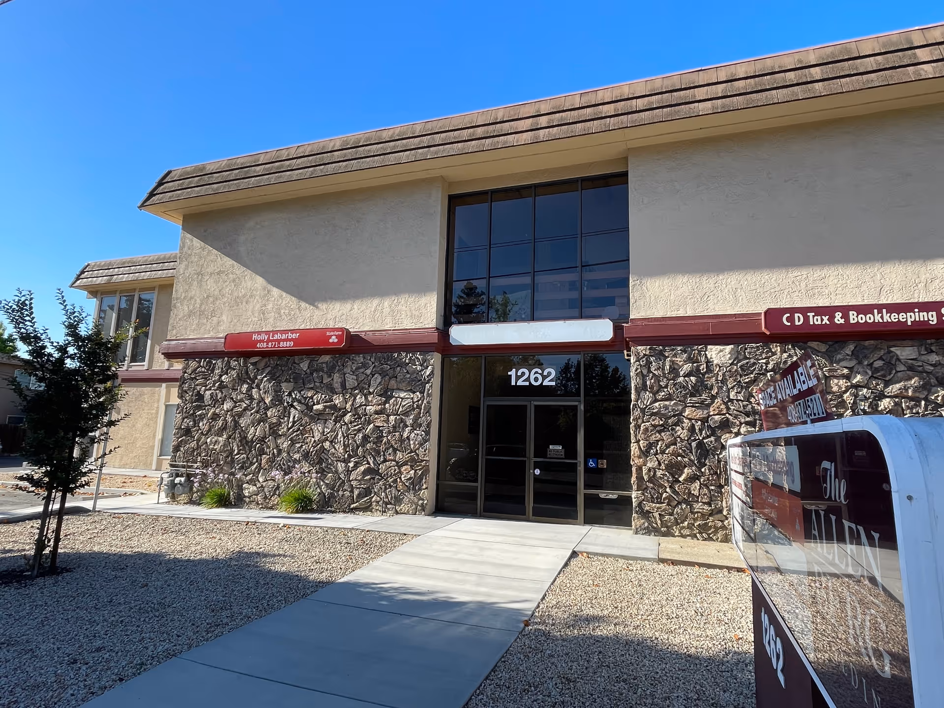 Exterior view of a Senior Helpers facility entrance with stone facade.