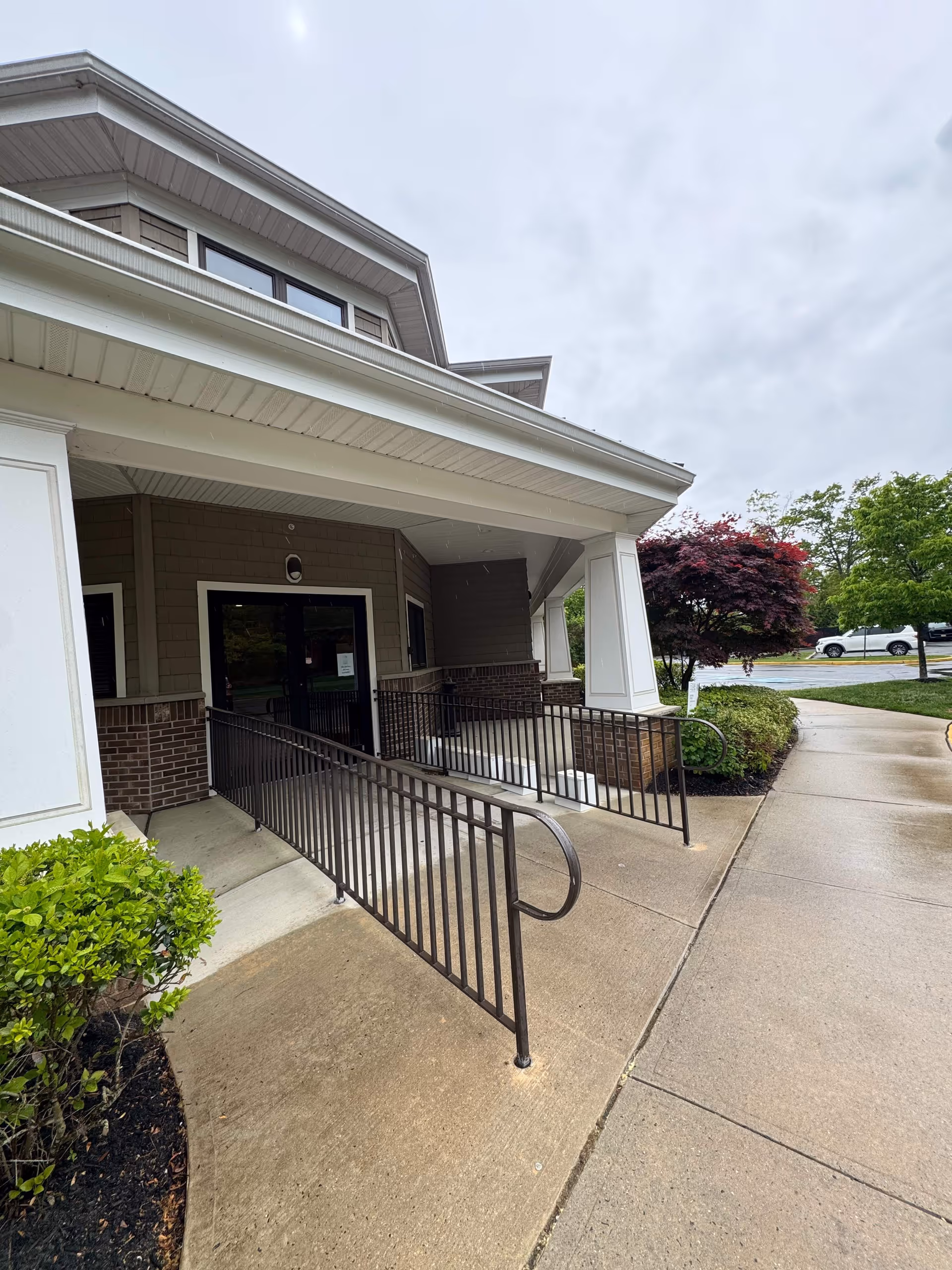 Exterior view of BAYADA Home Health entrance with ramp and walkway.