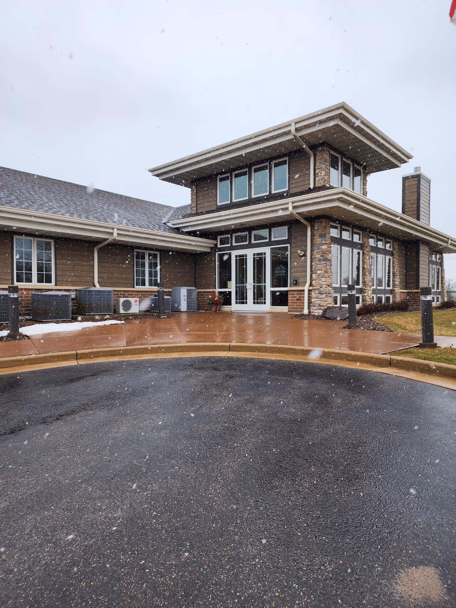 Exterior view of Aveanna Home Health facility entrance with snow.