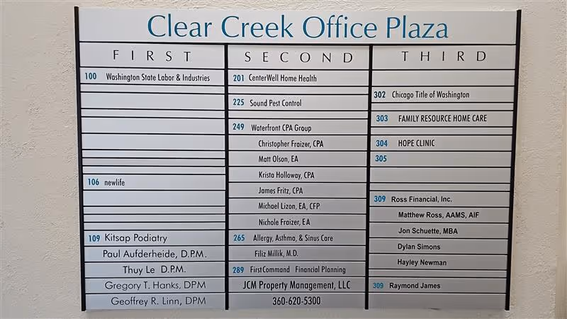 Indoor directory board for Clear Creek Office Plaza showing unit numbers, including Family Resource Home Care