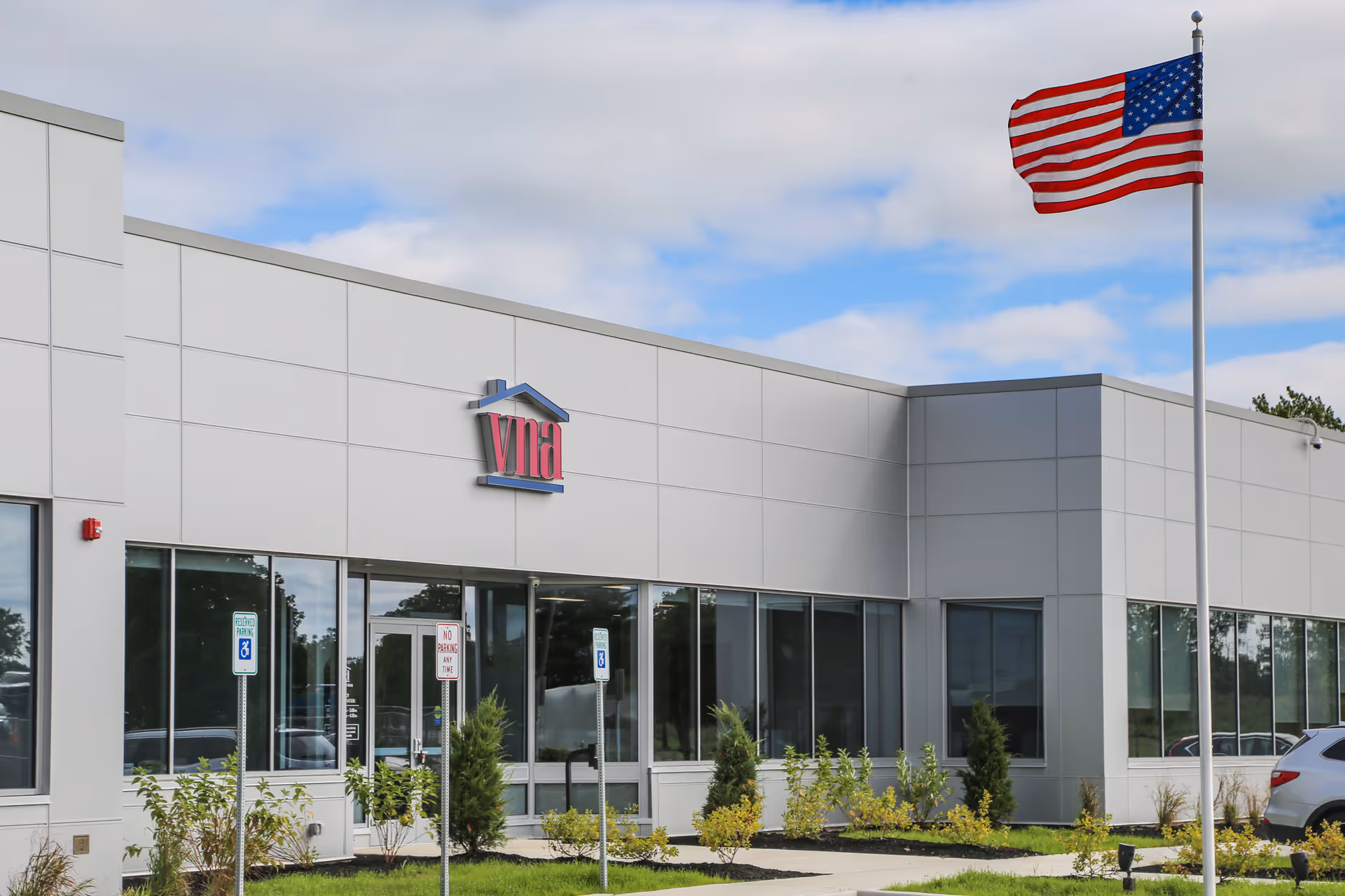 Modern VNA of WNY facility exterior with flagpole, logo, and landscaped front.