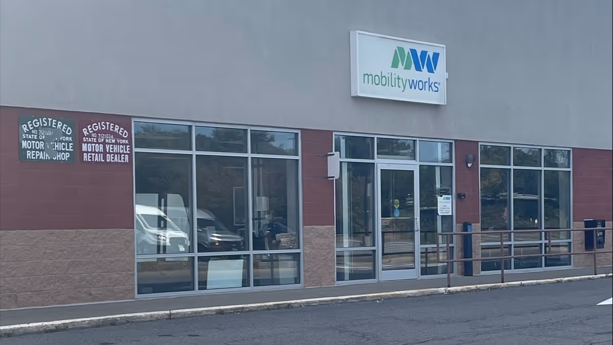 Exterior view of MobilityWorks storefront with glass windows and entrance doors.