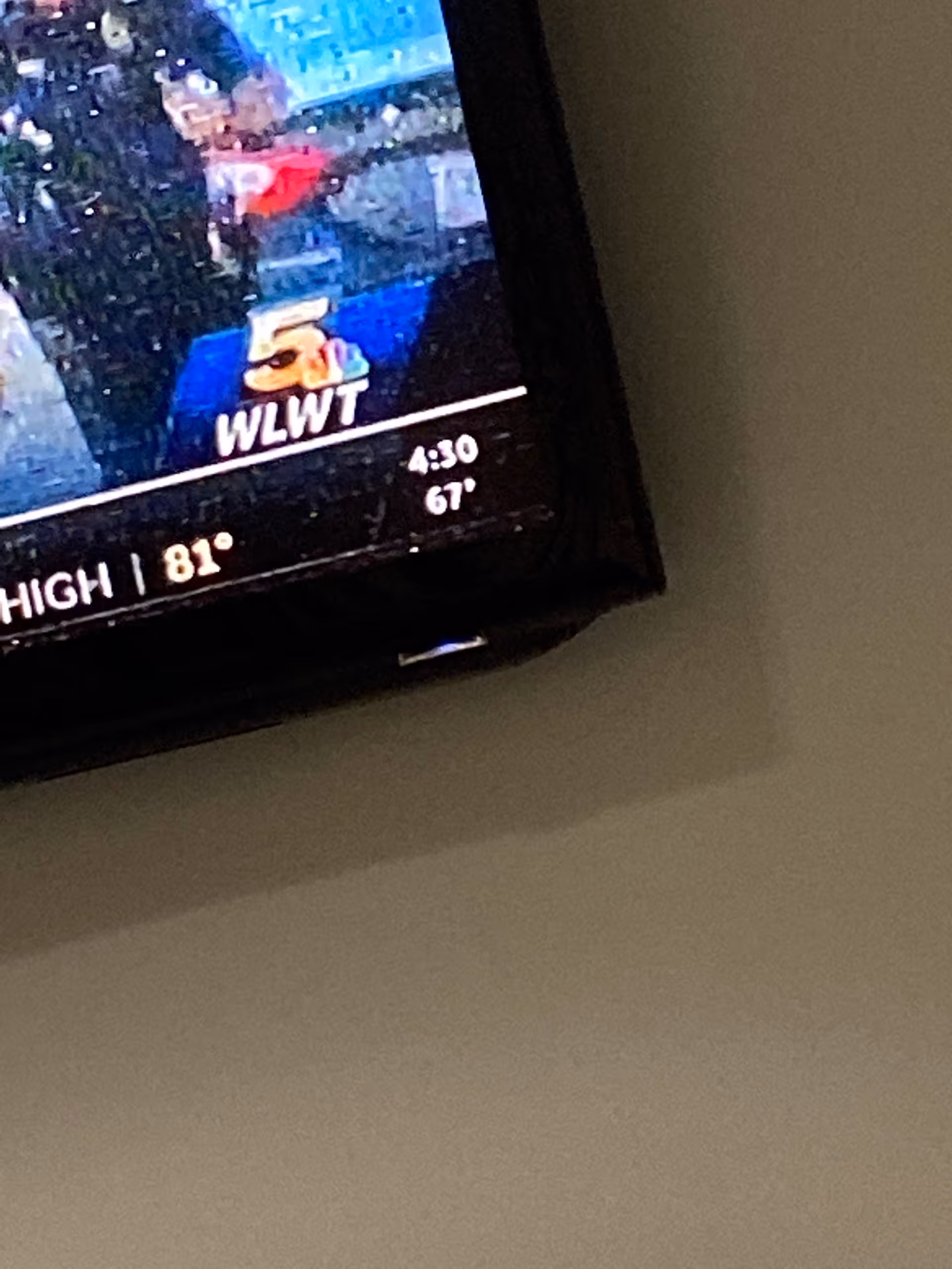 TV displaying weather with WLWT logo in a room