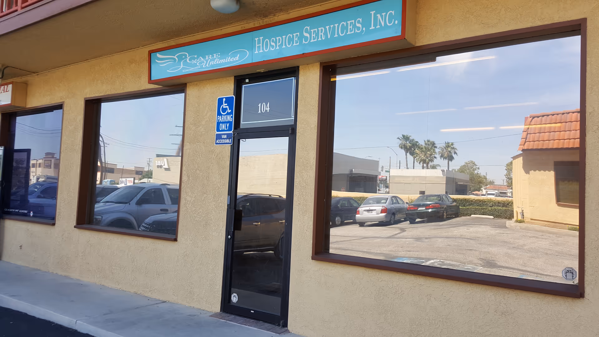 Exterior view of Care Unlimited Hospice Services, Inc. storefront with a parking lot.