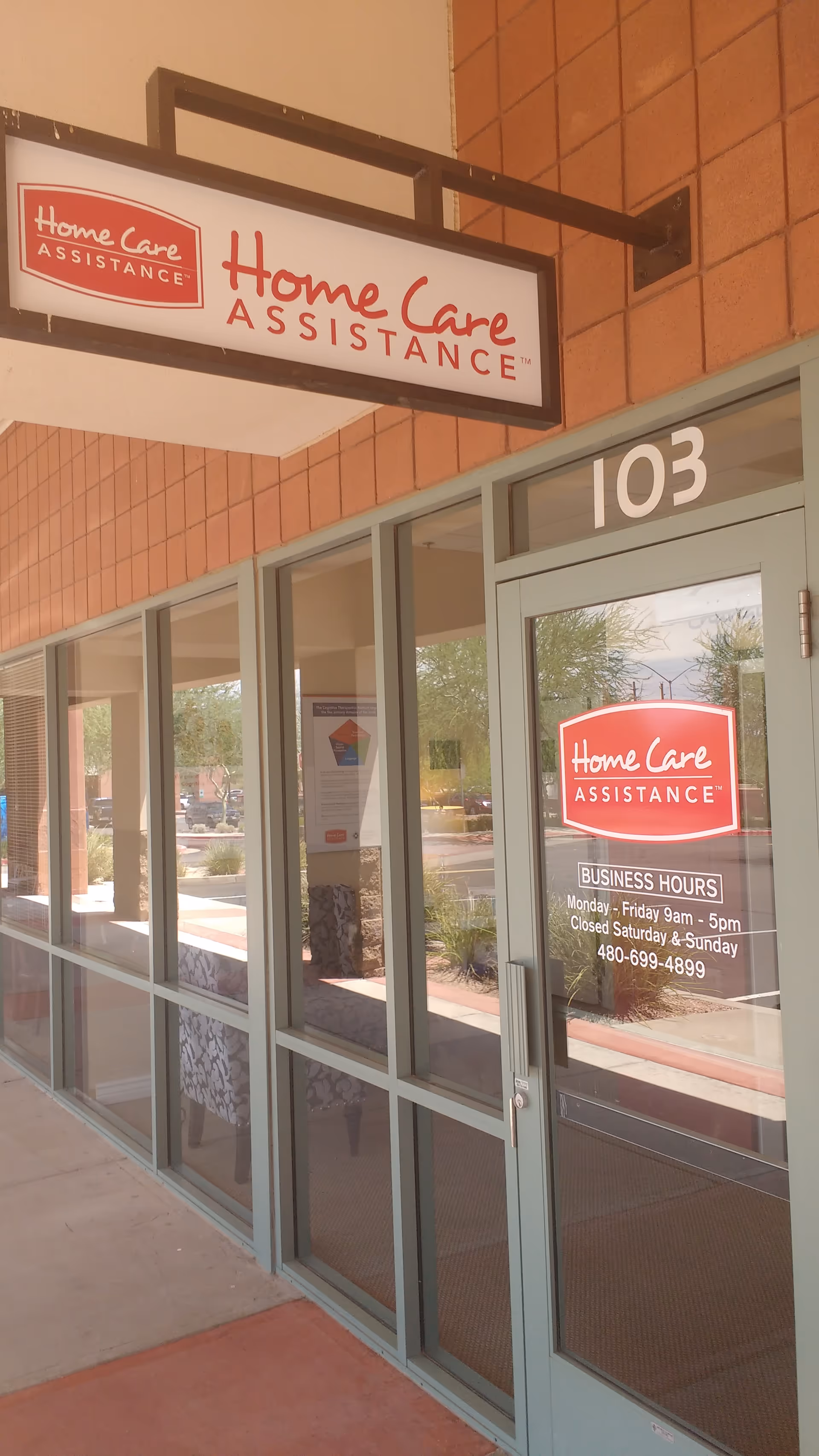 Exterior view of a Home Care Assistance storefront entrance with glass doors.