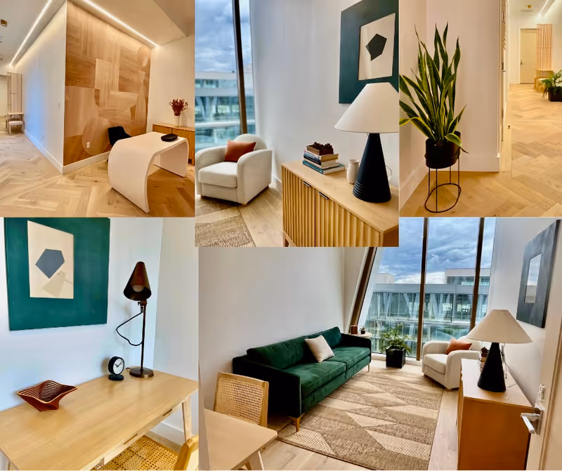Modern lounge interiors with sofas, chairs, plants, and large windows in a bright living area.
