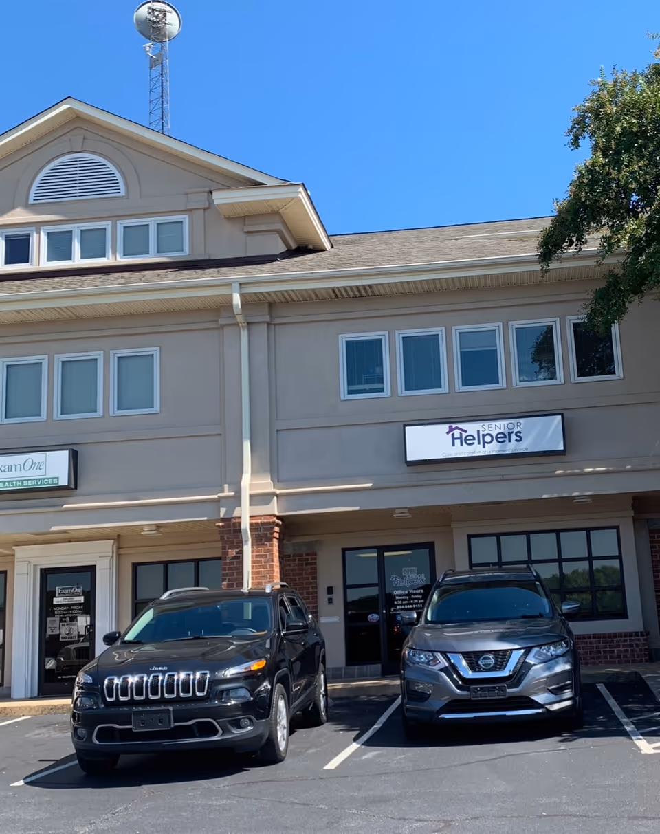 Exterior view of a Senior Helpers facility with cars parked in front