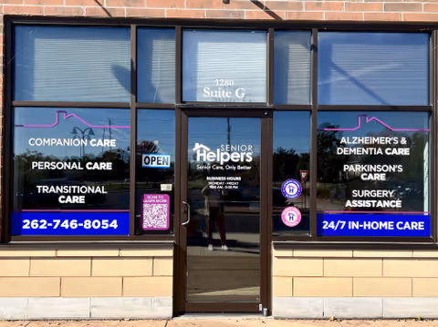 A Senior Helpers storefront with large windows and a central glass door