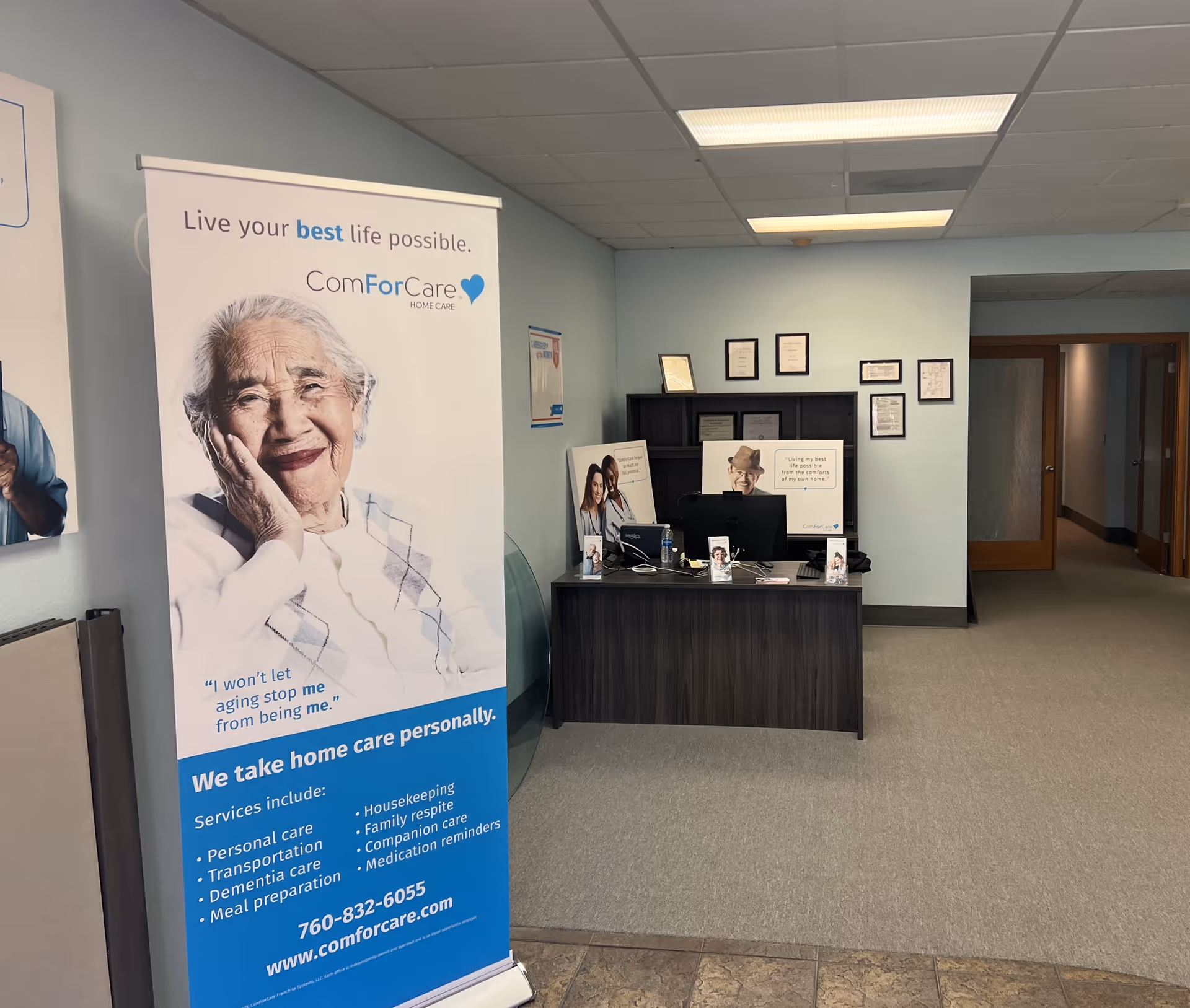 Reception area with a ComForCare banner and front desk